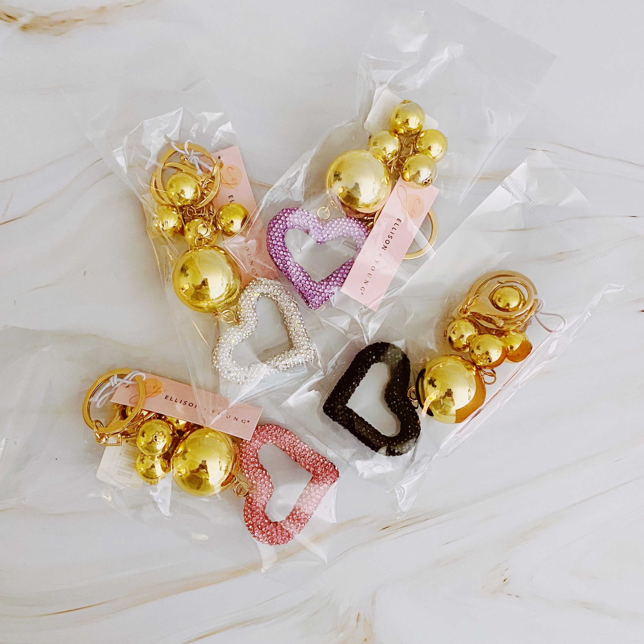 It Girl Glam Heart Bauble Key Chain featuring a stylish heart design, perfect for adding glam to bags and keys.