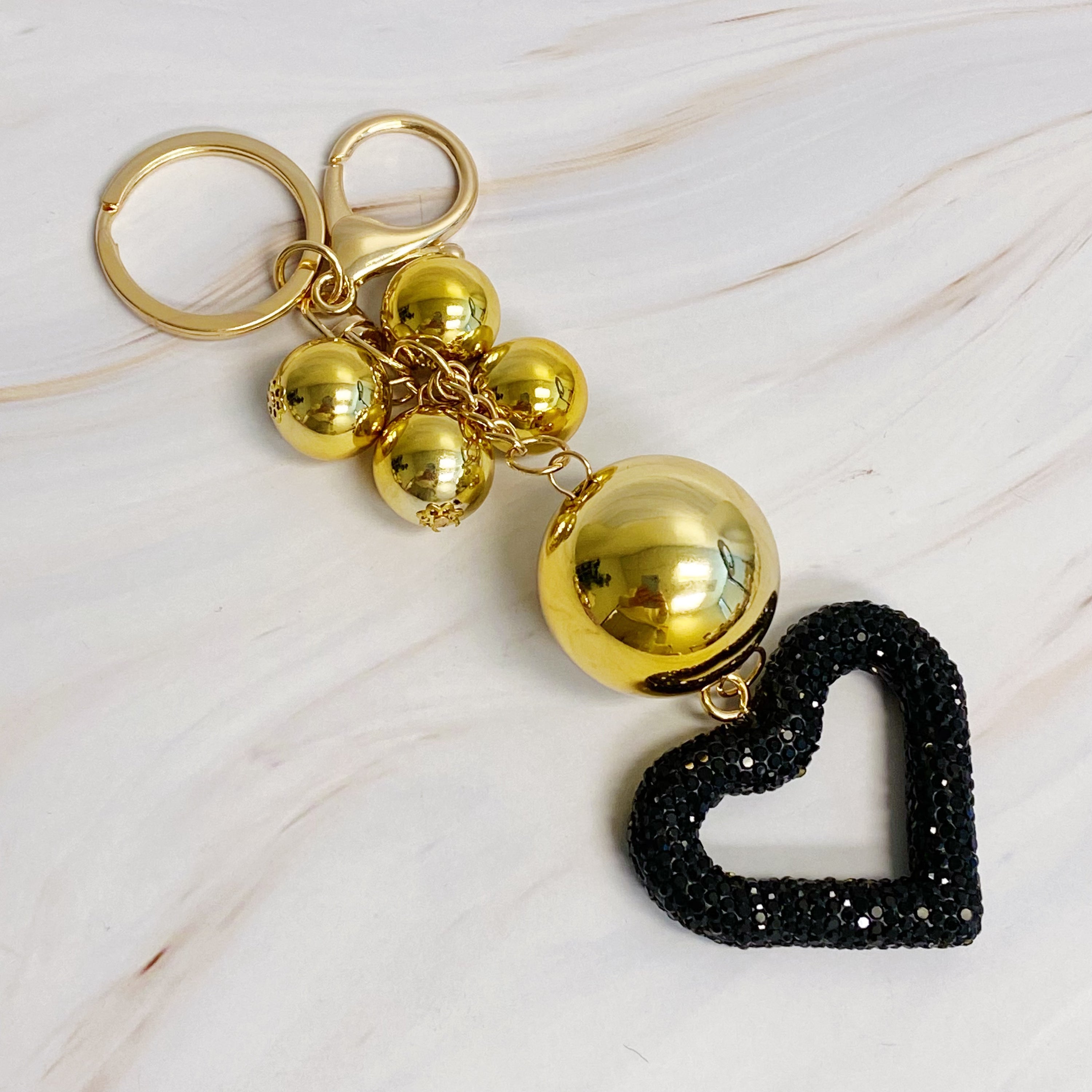 It Girl Glam Heart Bauble Key Chain featuring a stylish heart design, perfect for adding glam to bags and keys.