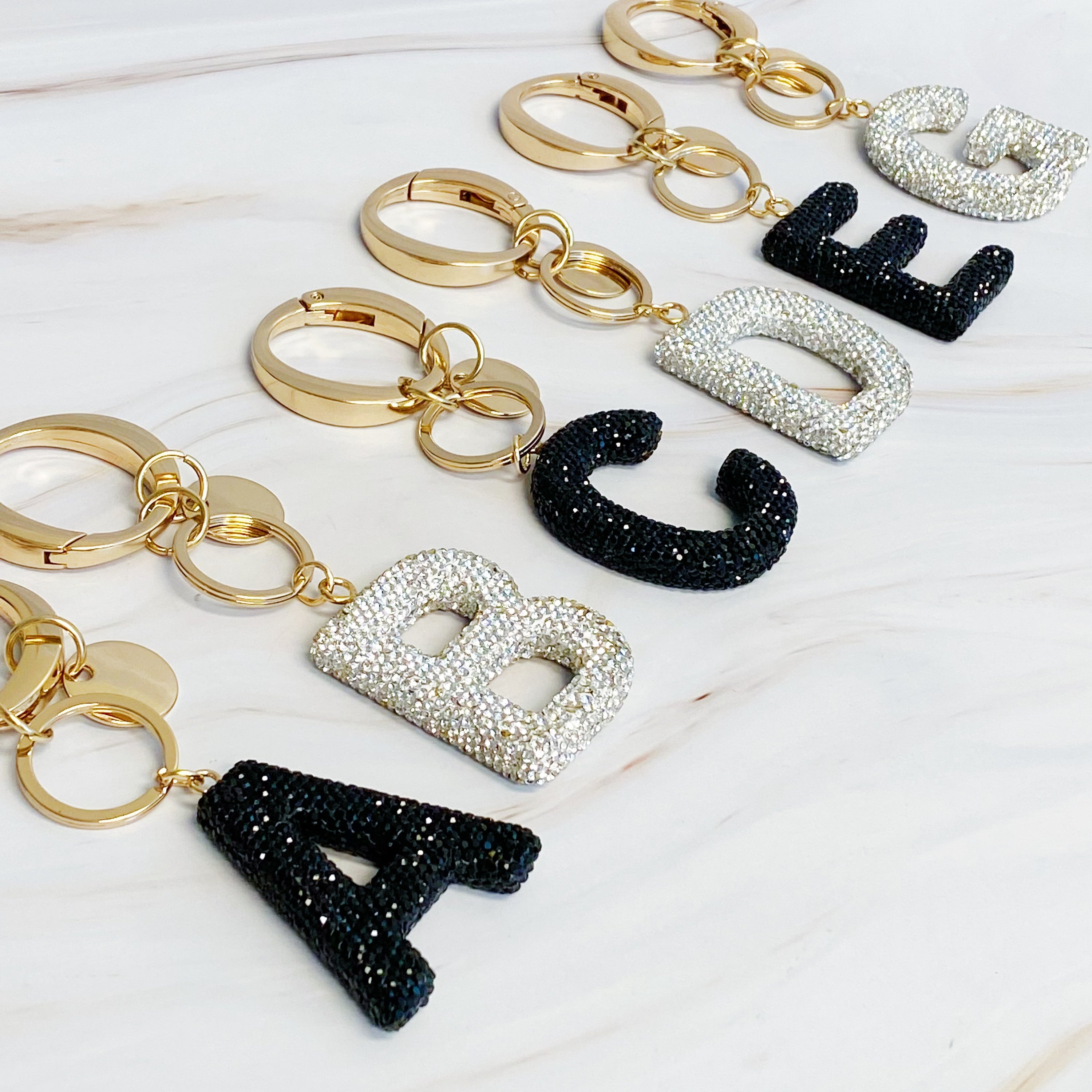 It Girl Glam Initial Key Chain featuring a stylish initial design, perfect for personal expression and gifting.