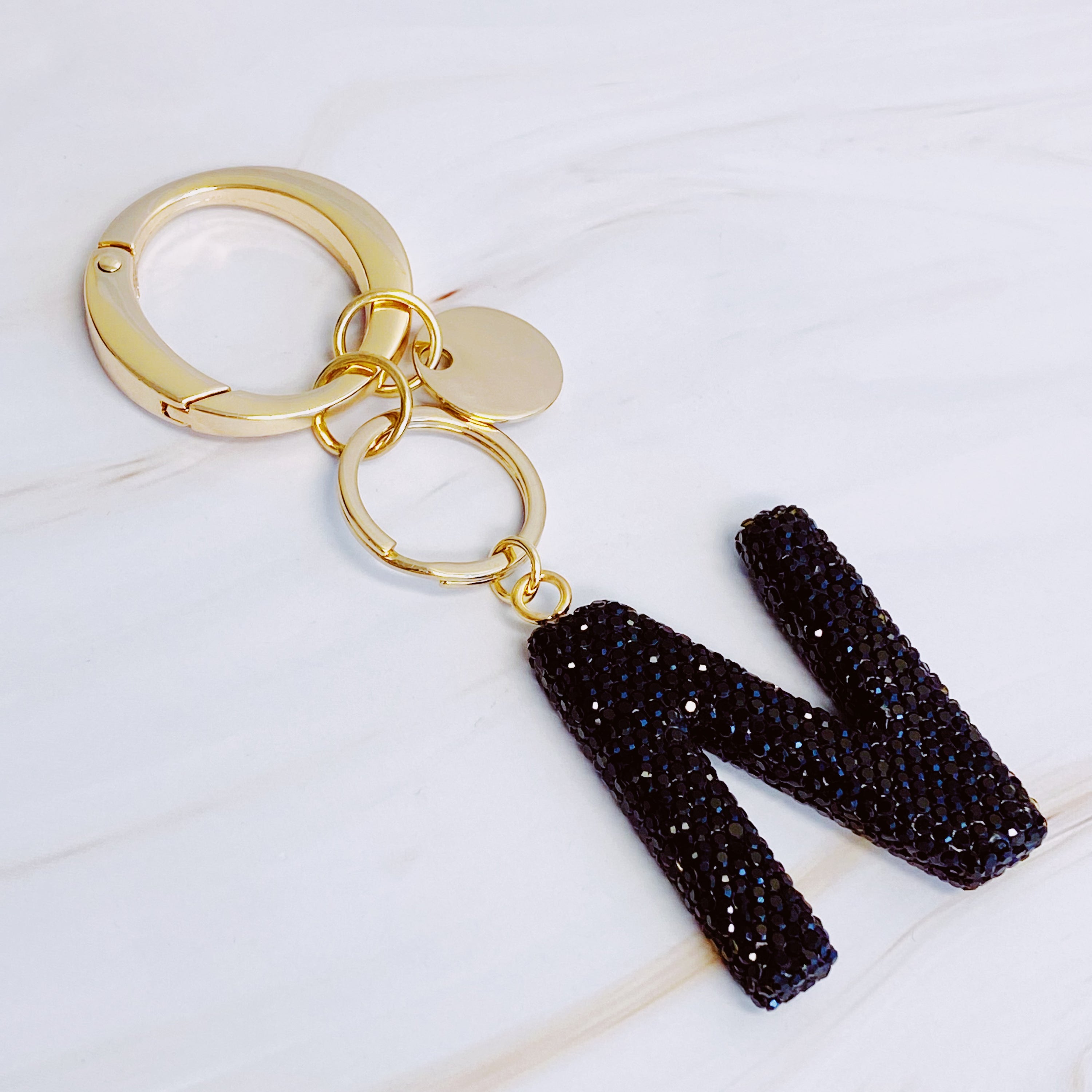 It Girl Glam Initial Key Chain featuring a stylish initial design, perfect for personal expression and gifting.