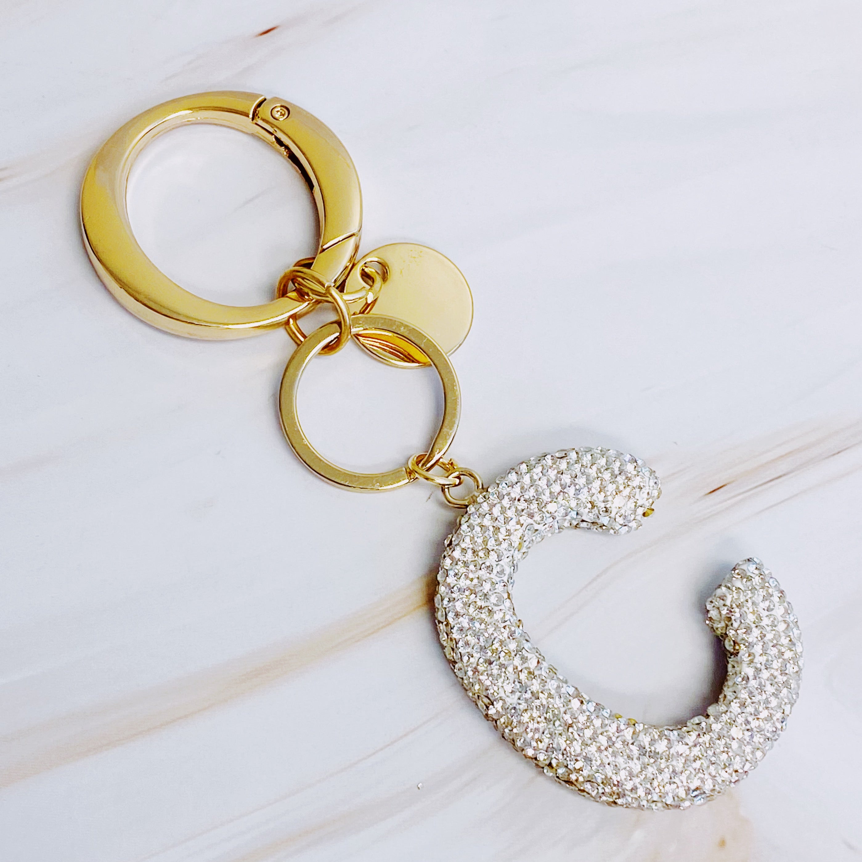 It Girl Glam Initial Key Chain featuring a stylish initial design, perfect for personal expression and gifting.