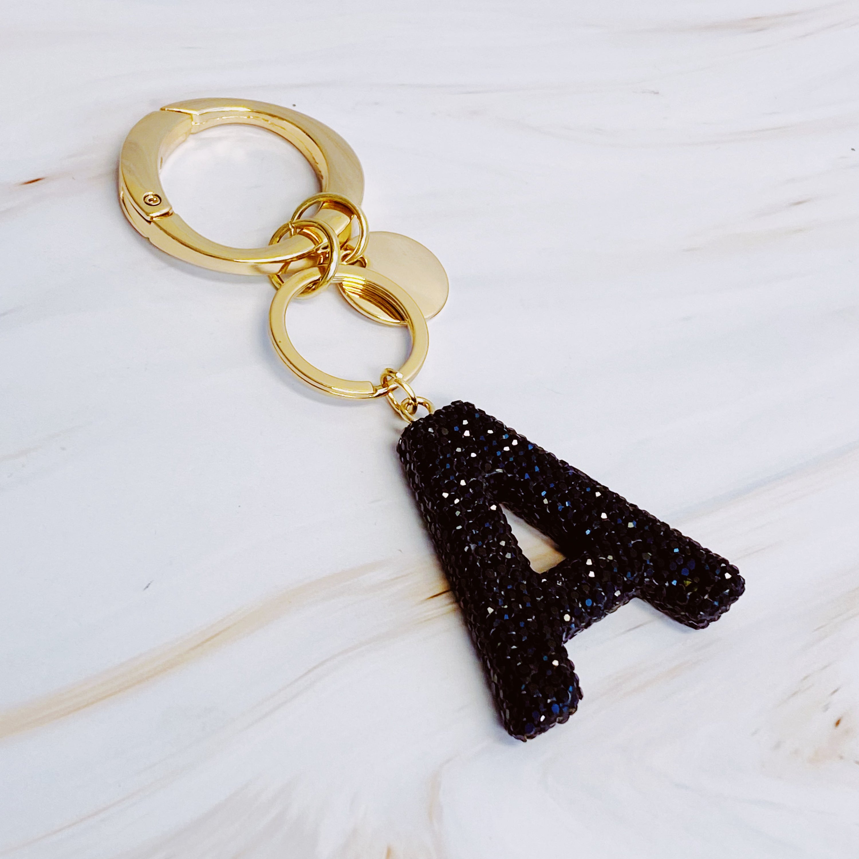 It Girl Glam Initial Key Chain featuring a stylish initial design, perfect for personal expression and gifting.