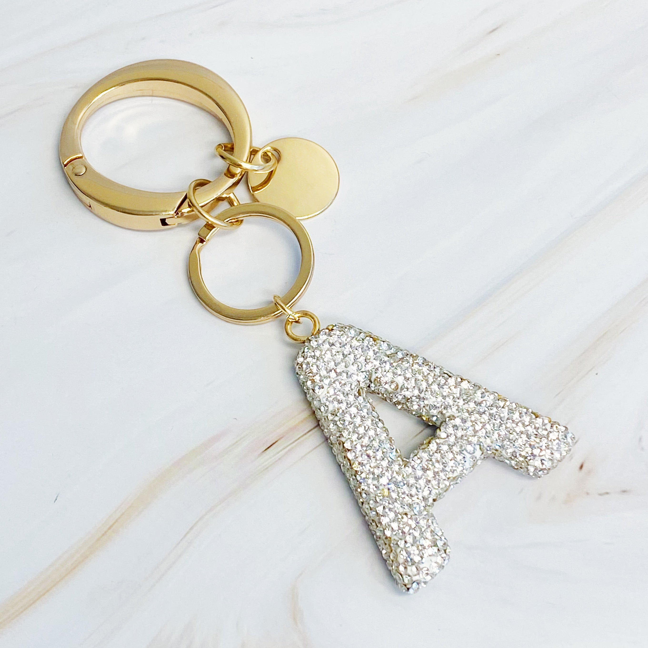 It Girl Glam Initial Key Chain featuring a stylish initial design, perfect for personal expression and gifting.