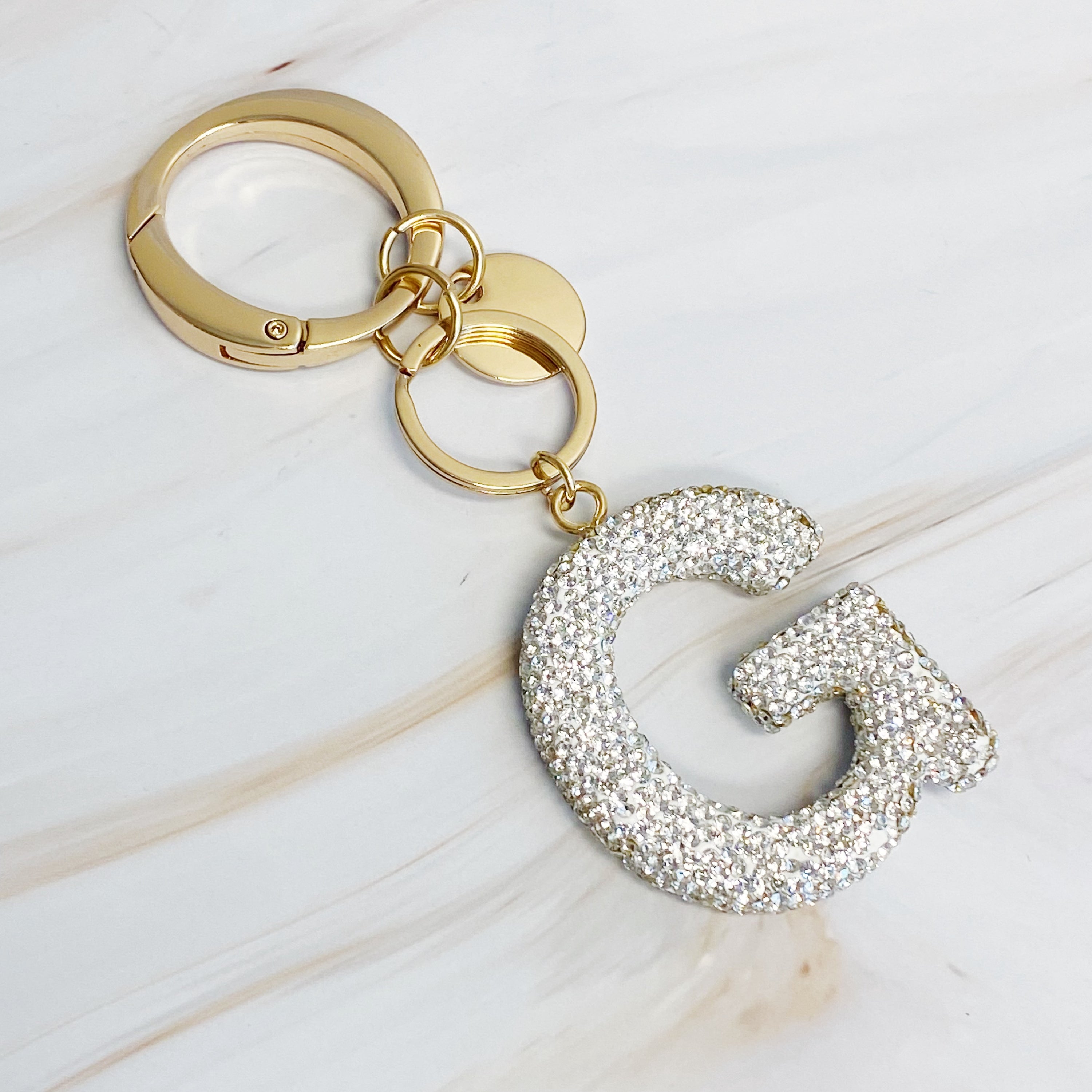 It Girl Glam Initial Key Chain featuring a stylish initial design, perfect for personal expression and gifting.