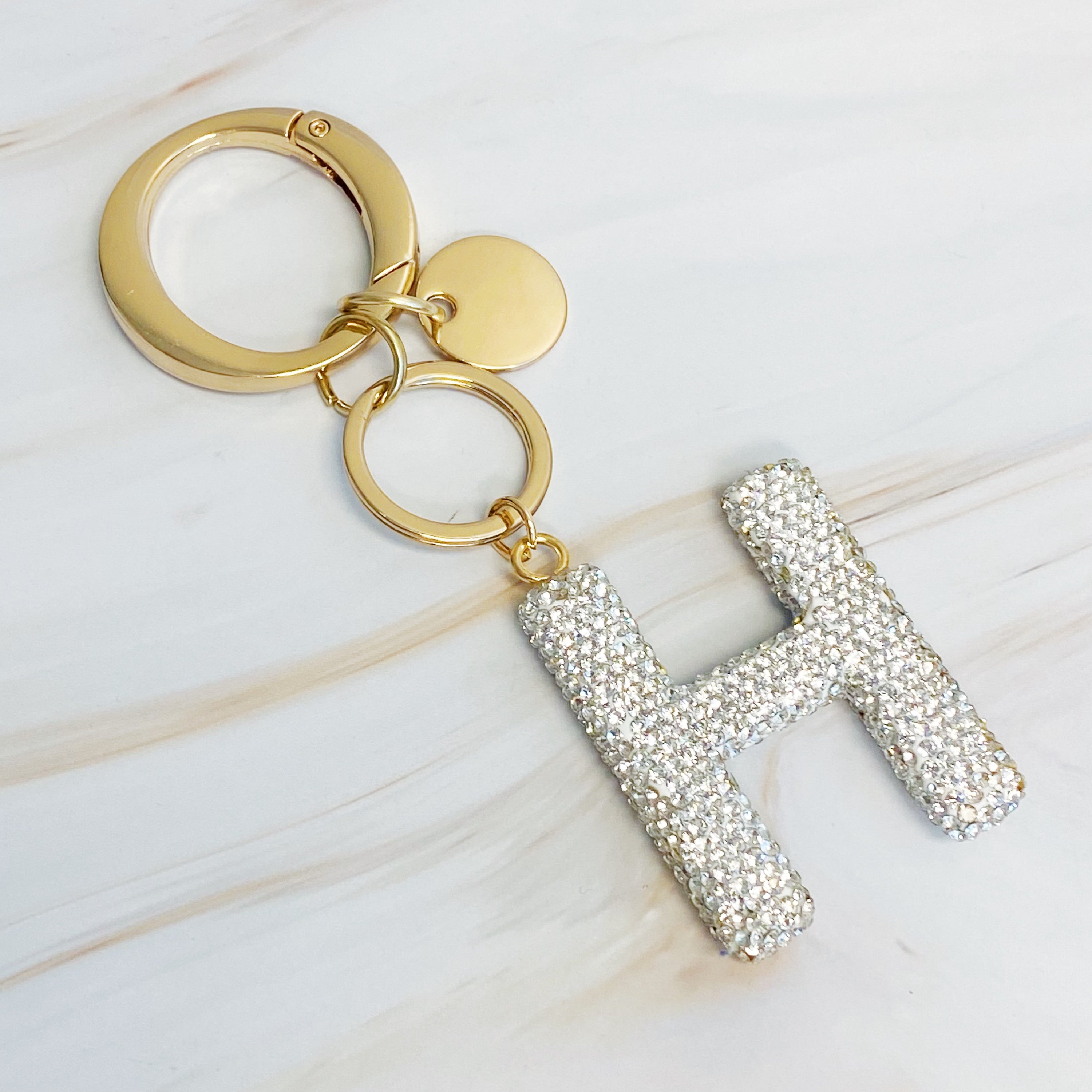 It Girl Glam Initial Key Chain featuring a stylish initial design, perfect for personal expression and gifting.