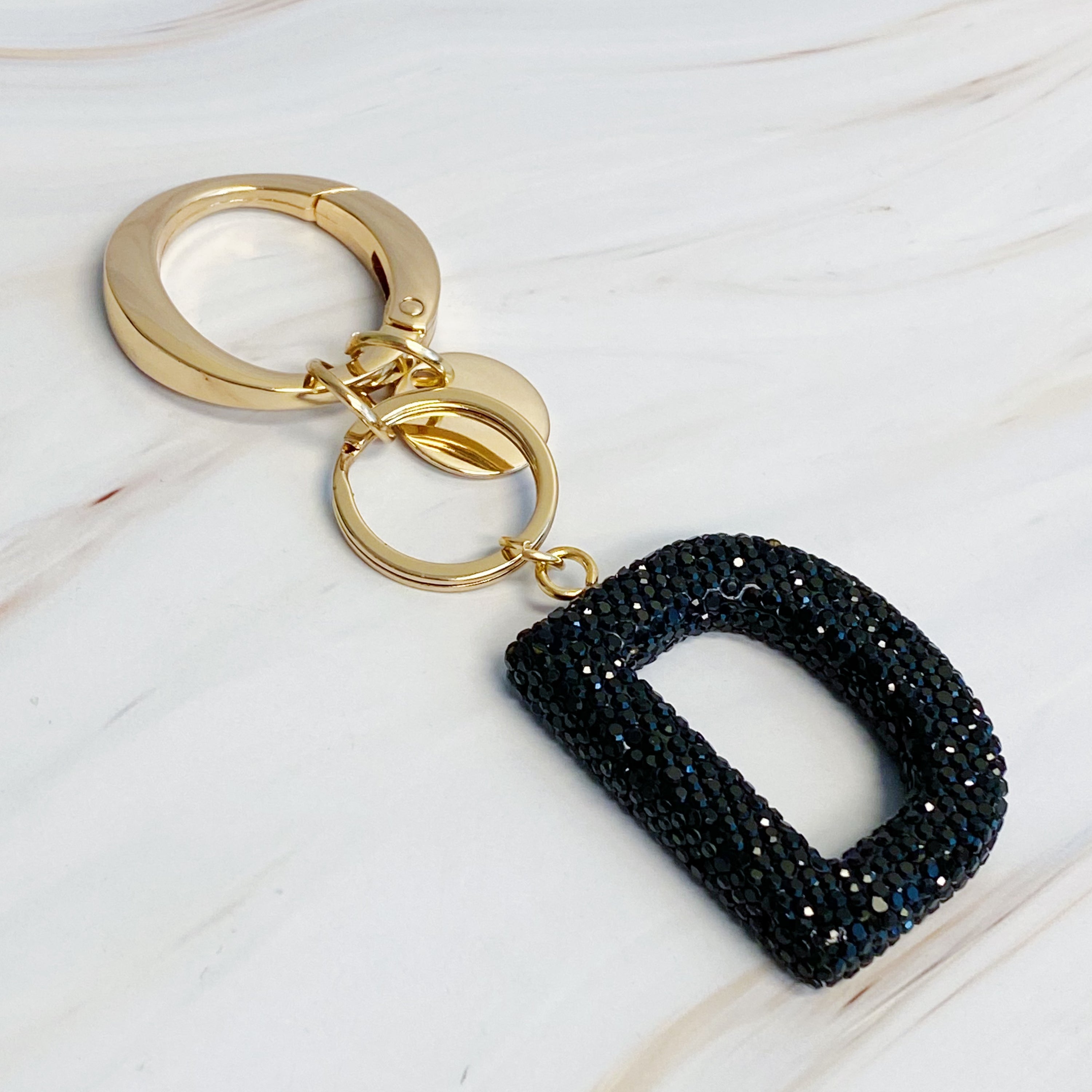 It Girl Glam Initial Key Chain featuring a stylish initial design, perfect for personal expression and gifting.