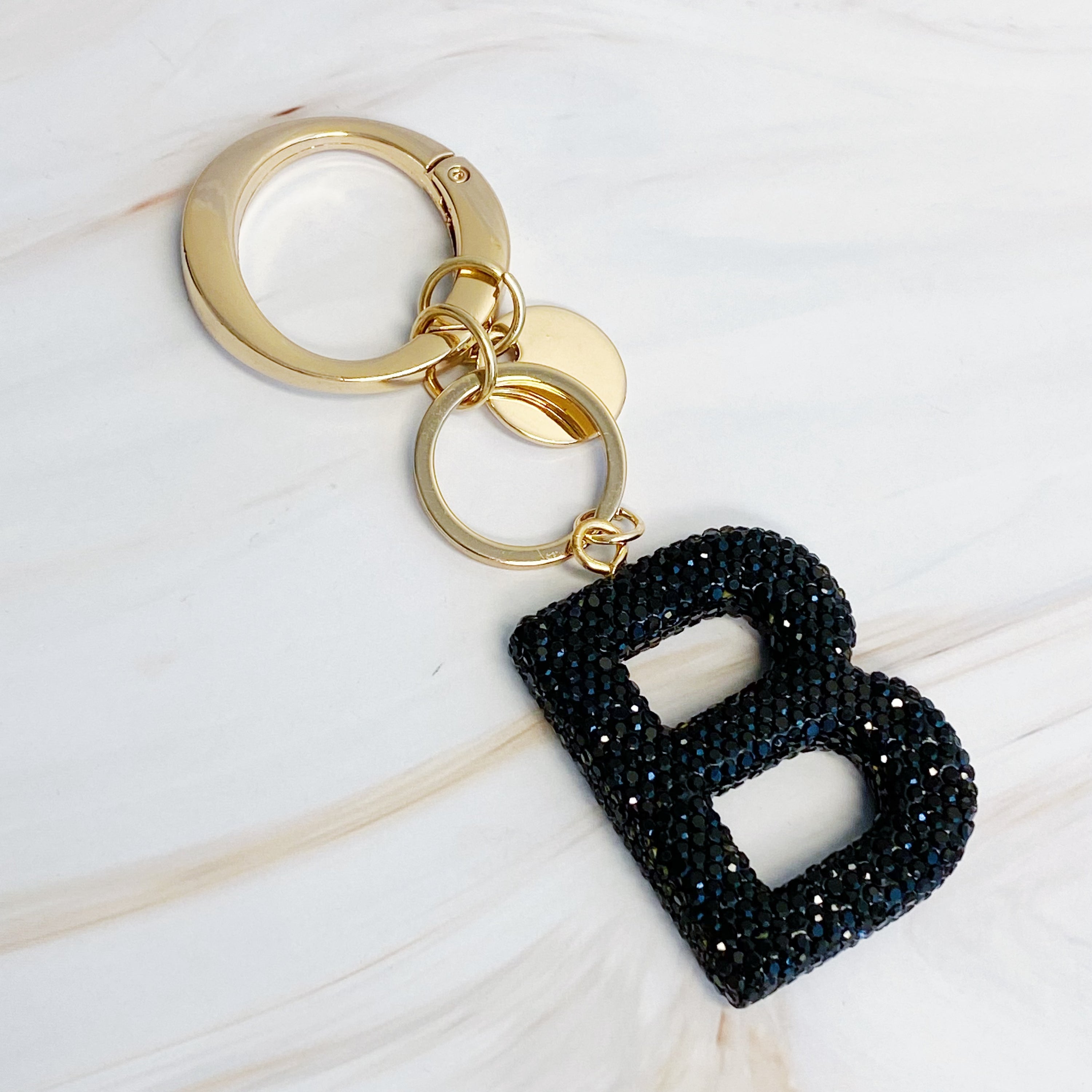 It Girl Glam Initial Key Chain featuring a stylish initial design, perfect for personal expression and gifting.