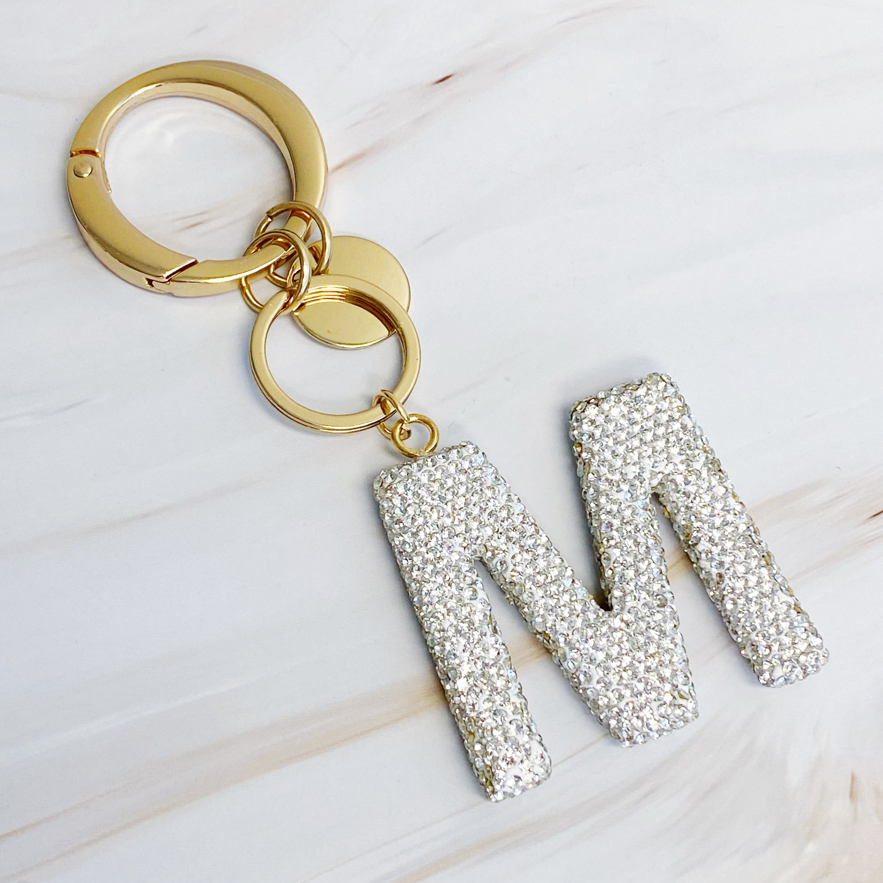 It Girl Glam Initial Key Chain featuring a stylish initial design, perfect for personal expression and gifting.