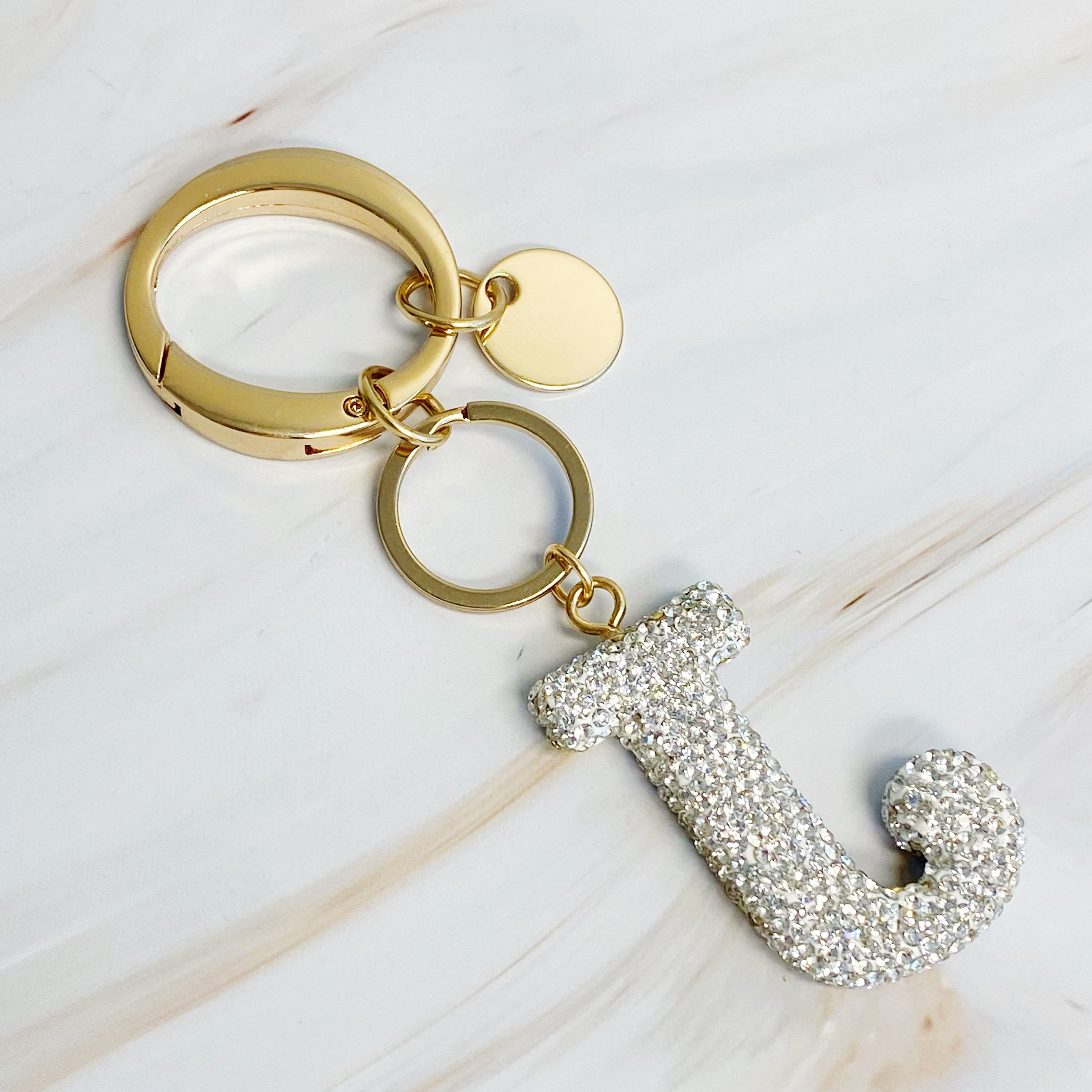 It Girl Glam Initial Key Chain featuring a stylish initial design, perfect for personal expression and gifting.