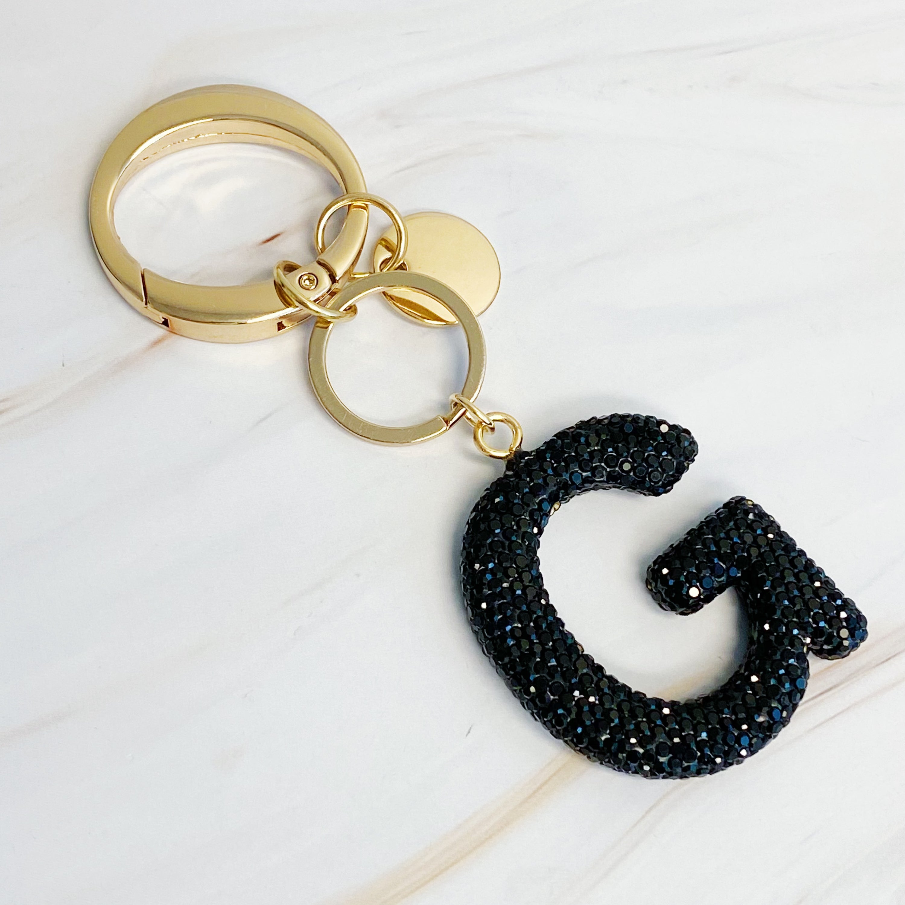 It Girl Glam Initial Key Chain featuring a stylish initial design, perfect for personal expression and gifting.