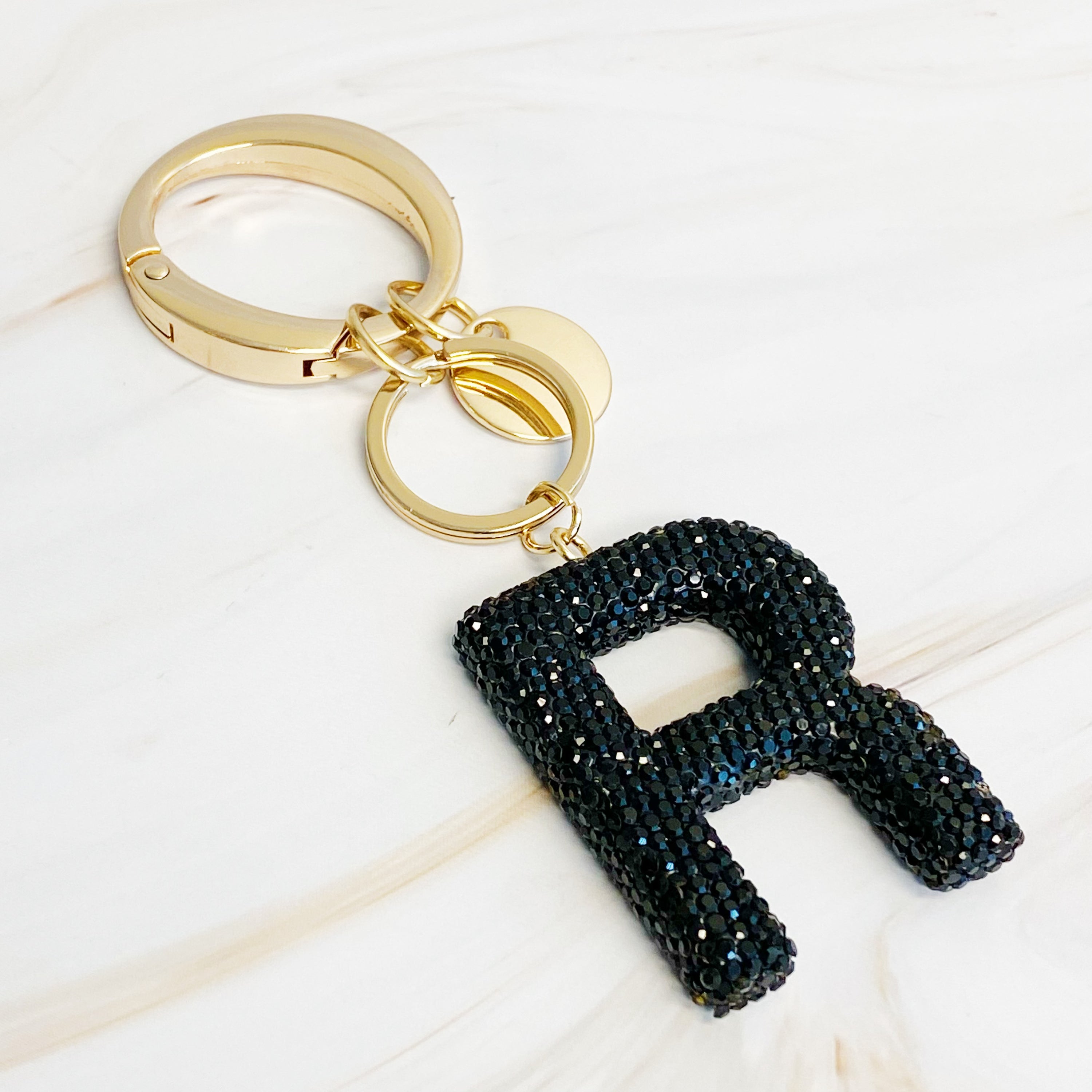 It Girl Glam Initial Key Chain featuring a stylish initial design, perfect for personal expression and gifting.