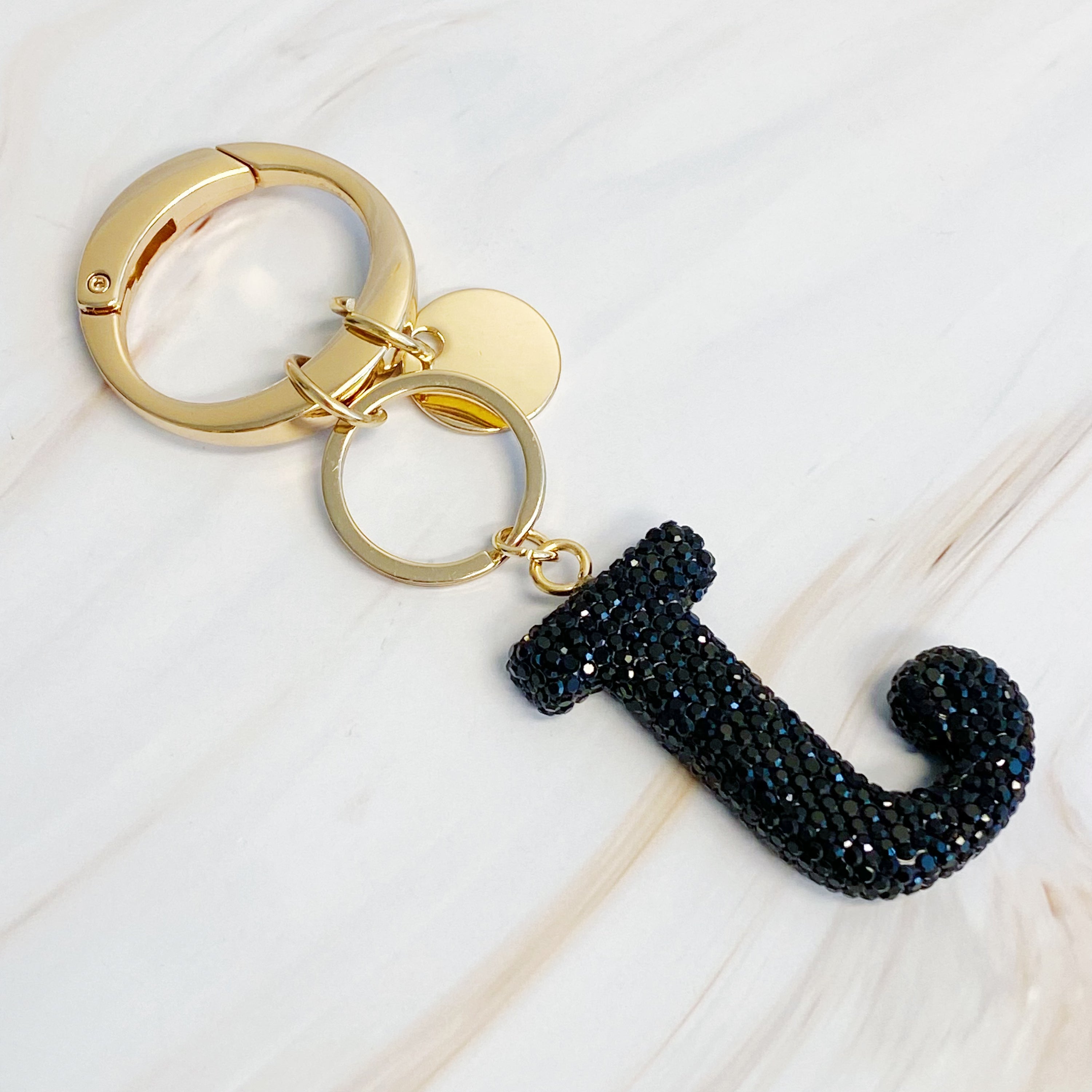 It Girl Glam Initial Key Chain featuring a stylish initial design, perfect for personal expression and gifting.