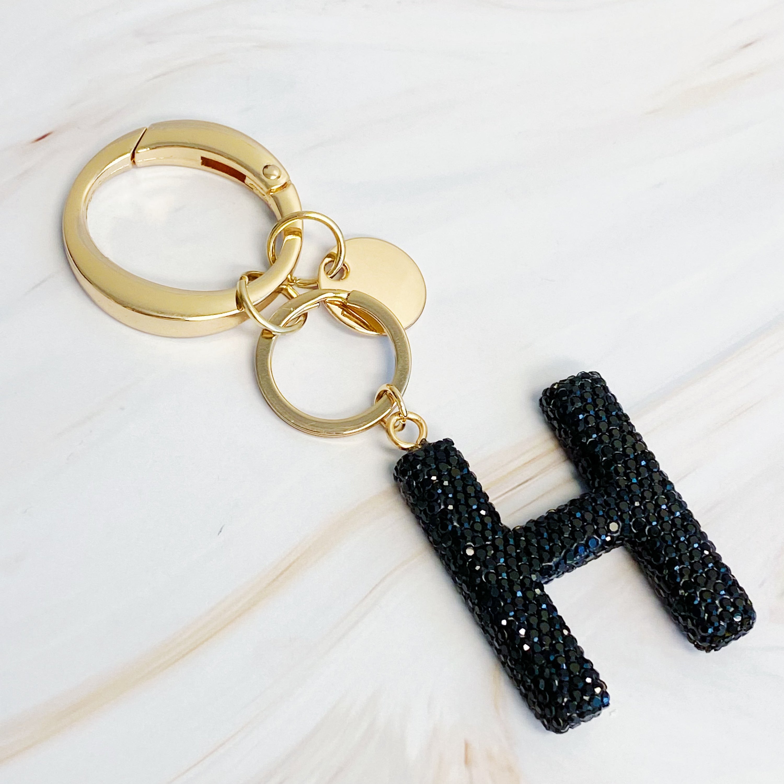 It Girl Glam Initial Key Chain featuring a stylish initial design, perfect for personal expression and gifting.