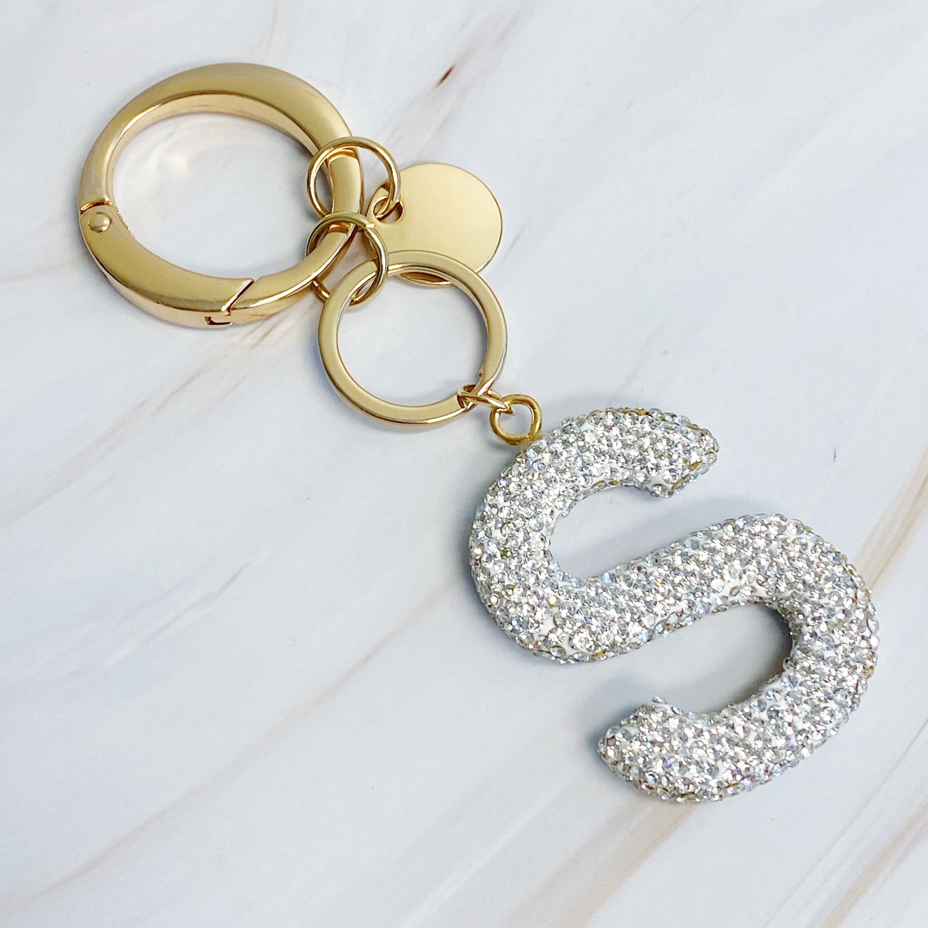 It Girl Glam Initial Key Chain featuring a stylish initial design, perfect for personal expression and gifting.