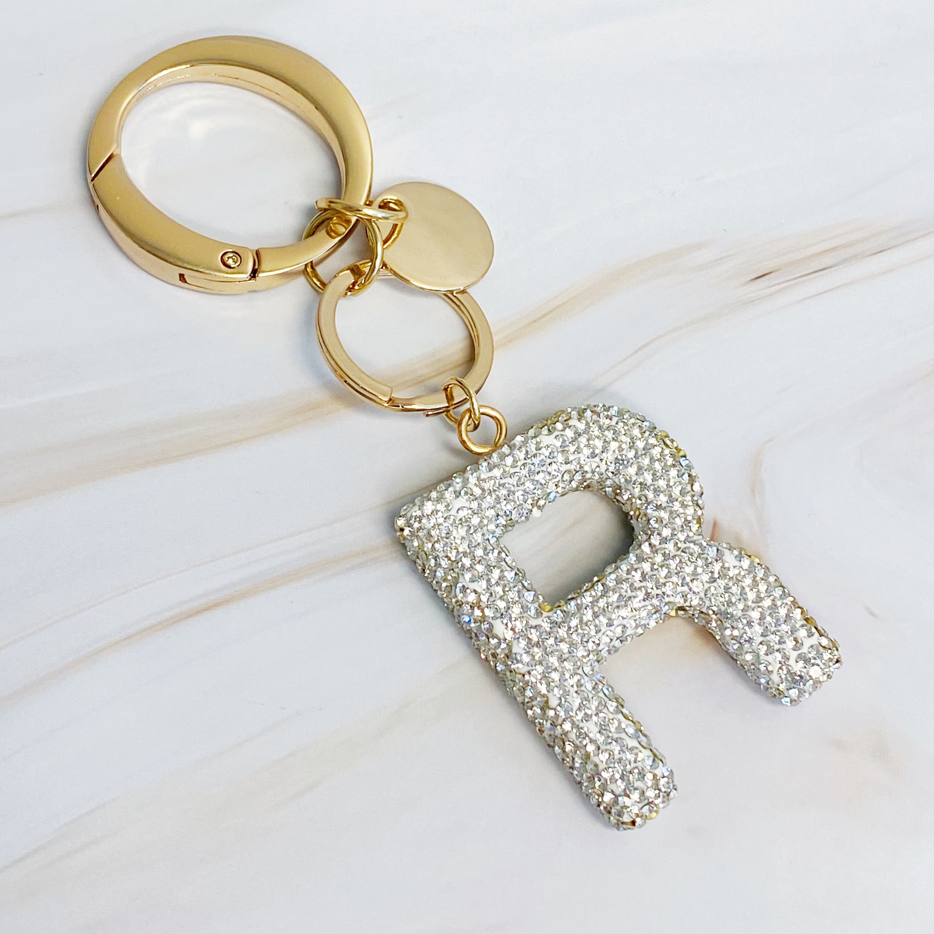 It Girl Glam Initial Key Chain featuring a stylish initial design, perfect for personal expression and gifting.