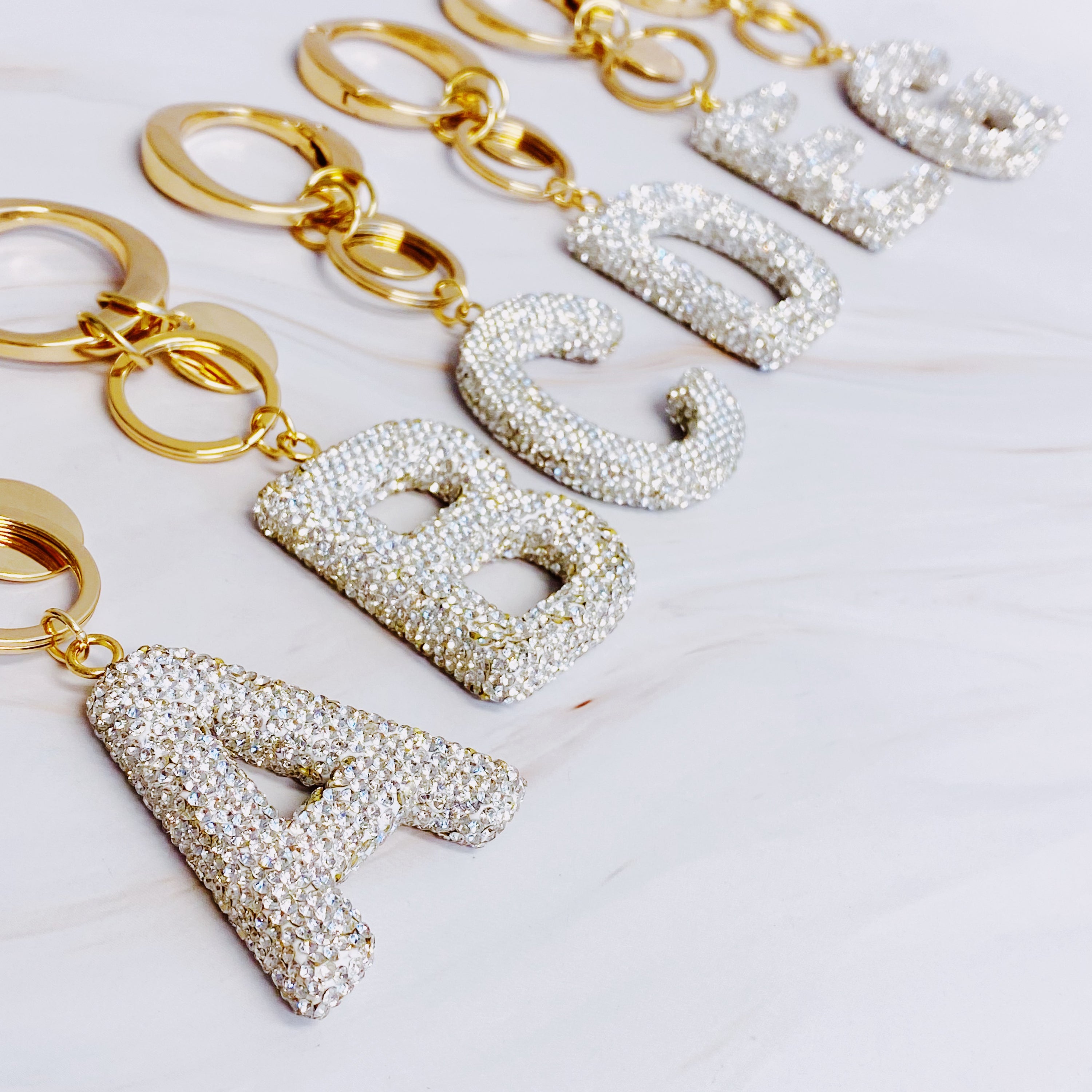 It Girl Glam Initial Key Chain featuring a stylish initial design, perfect for personal expression and gifting.