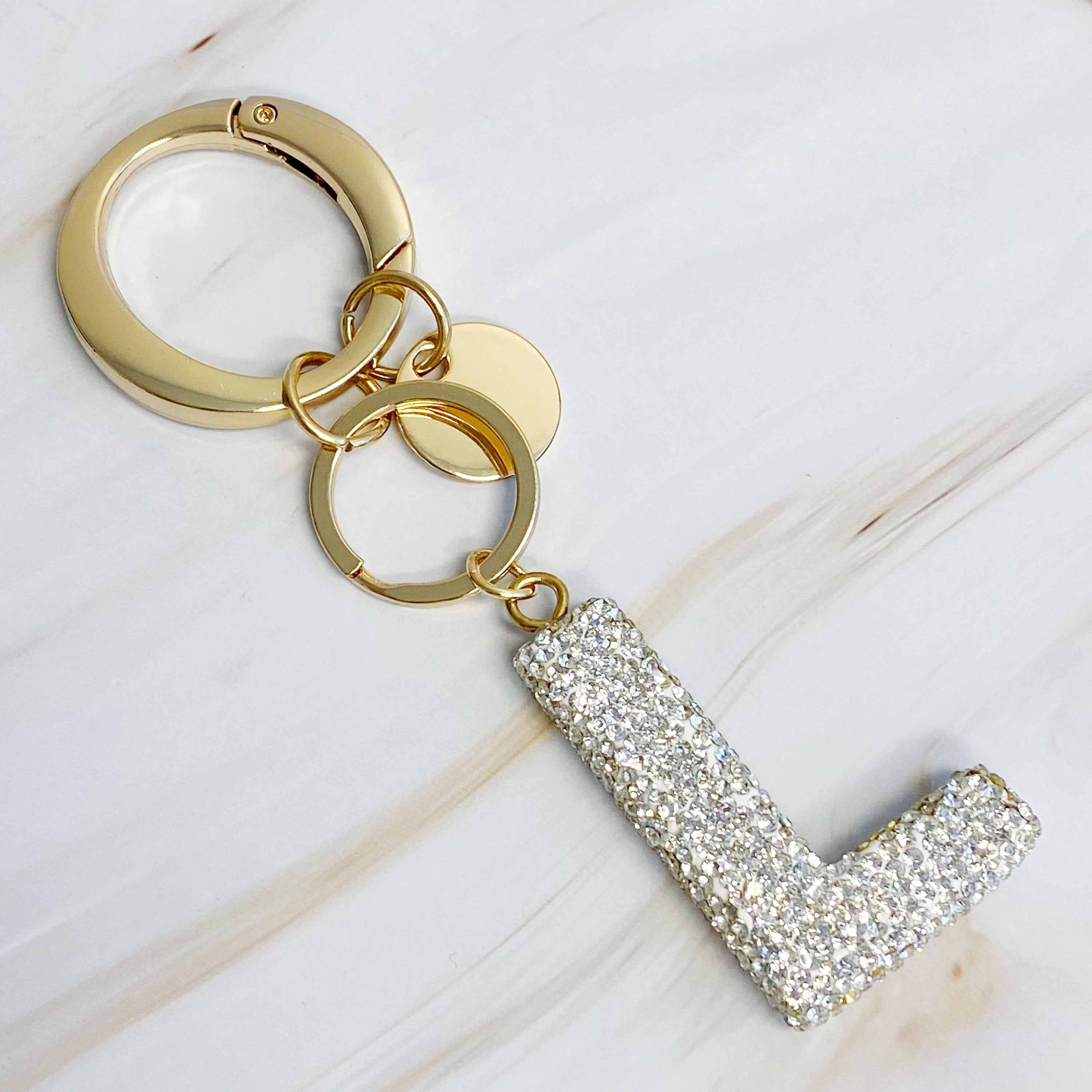 It Girl Glam Initial Key Chain featuring a stylish initial design, perfect for personal expression and gifting.