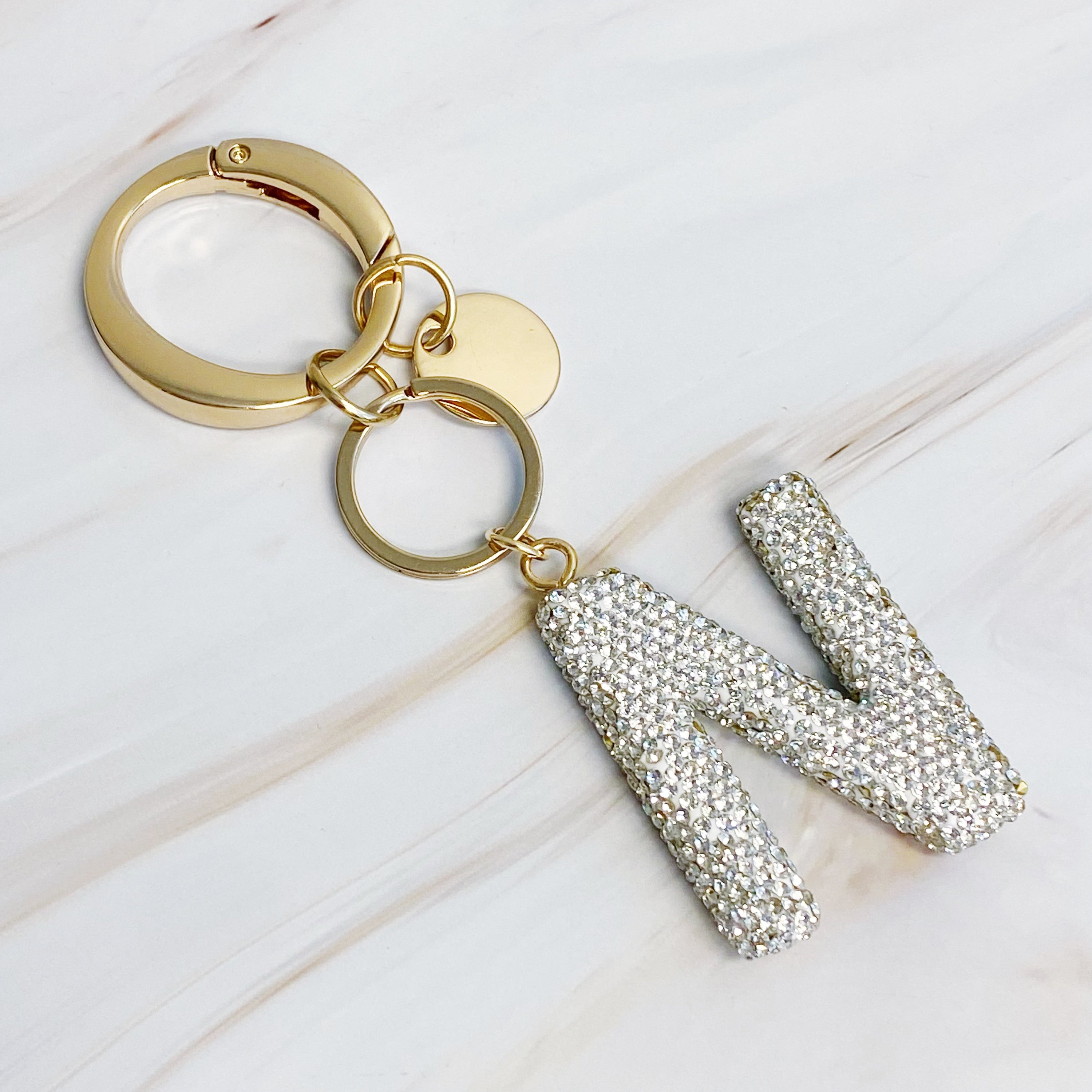 It Girl Glam Initial Key Chain featuring a stylish initial design, perfect for personal expression and gifting.