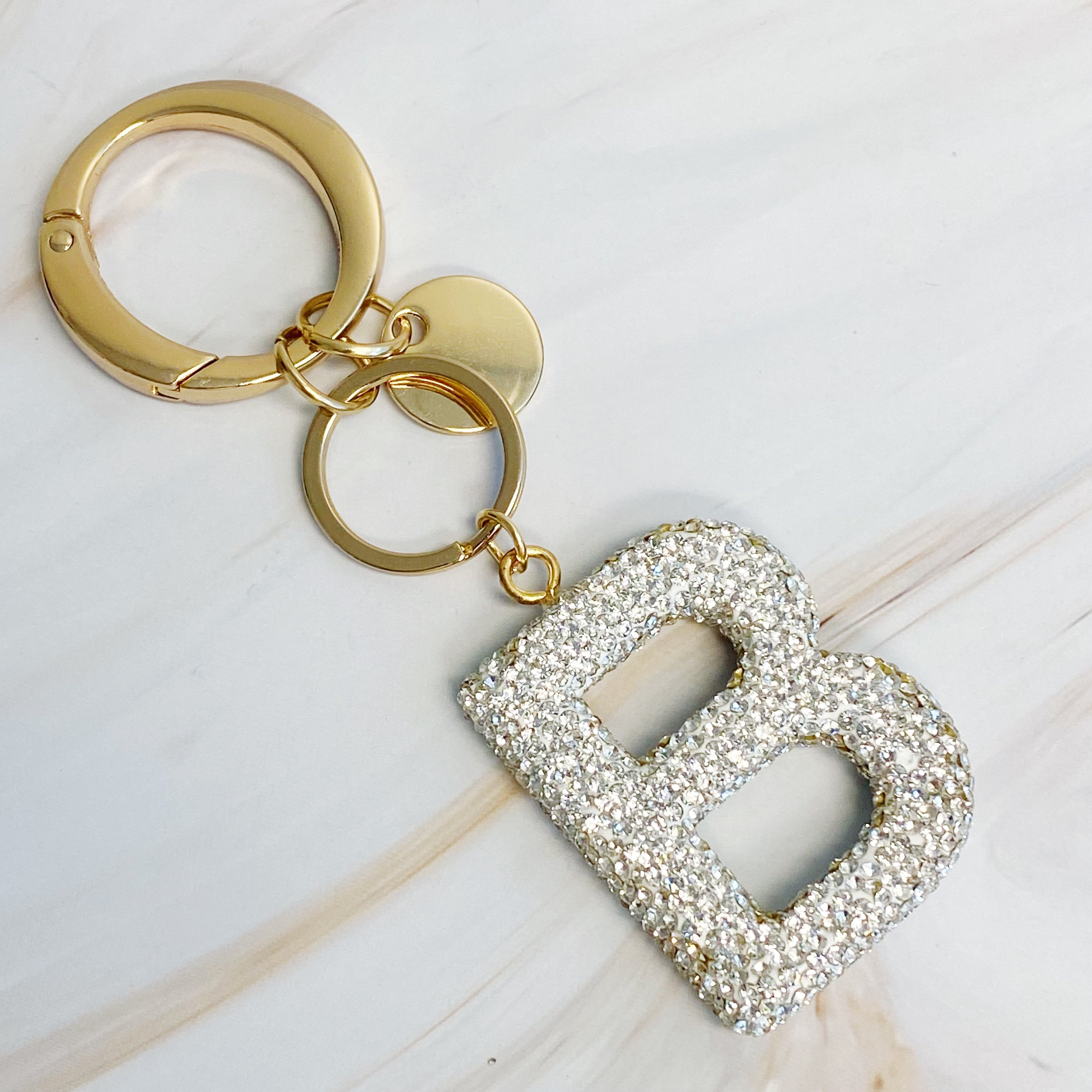 It Girl Glam Initial Key Chain featuring a stylish initial design, perfect for personal expression and gifting.