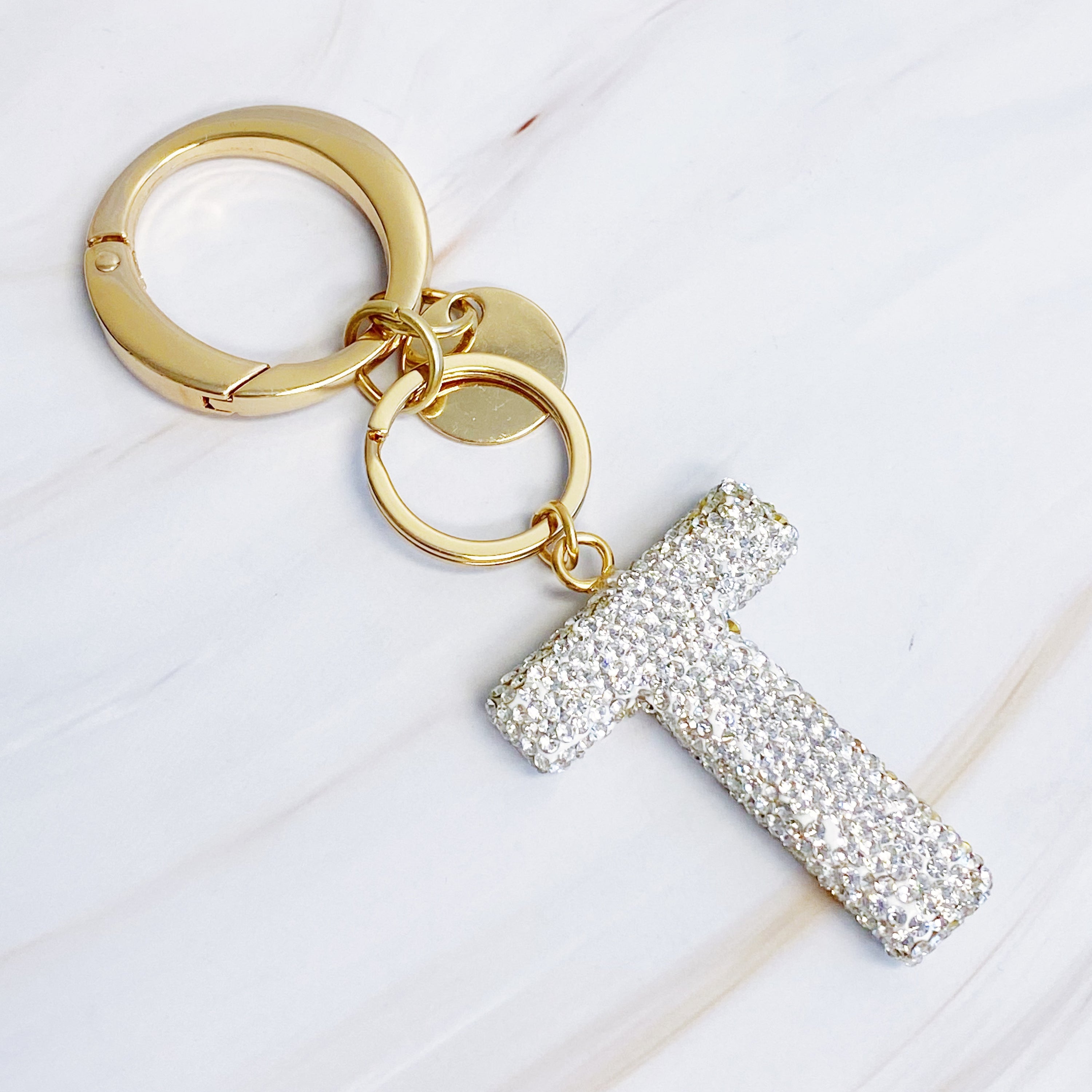 It Girl Glam Initial Key Chain featuring a stylish initial design, perfect for personal expression and gifting.