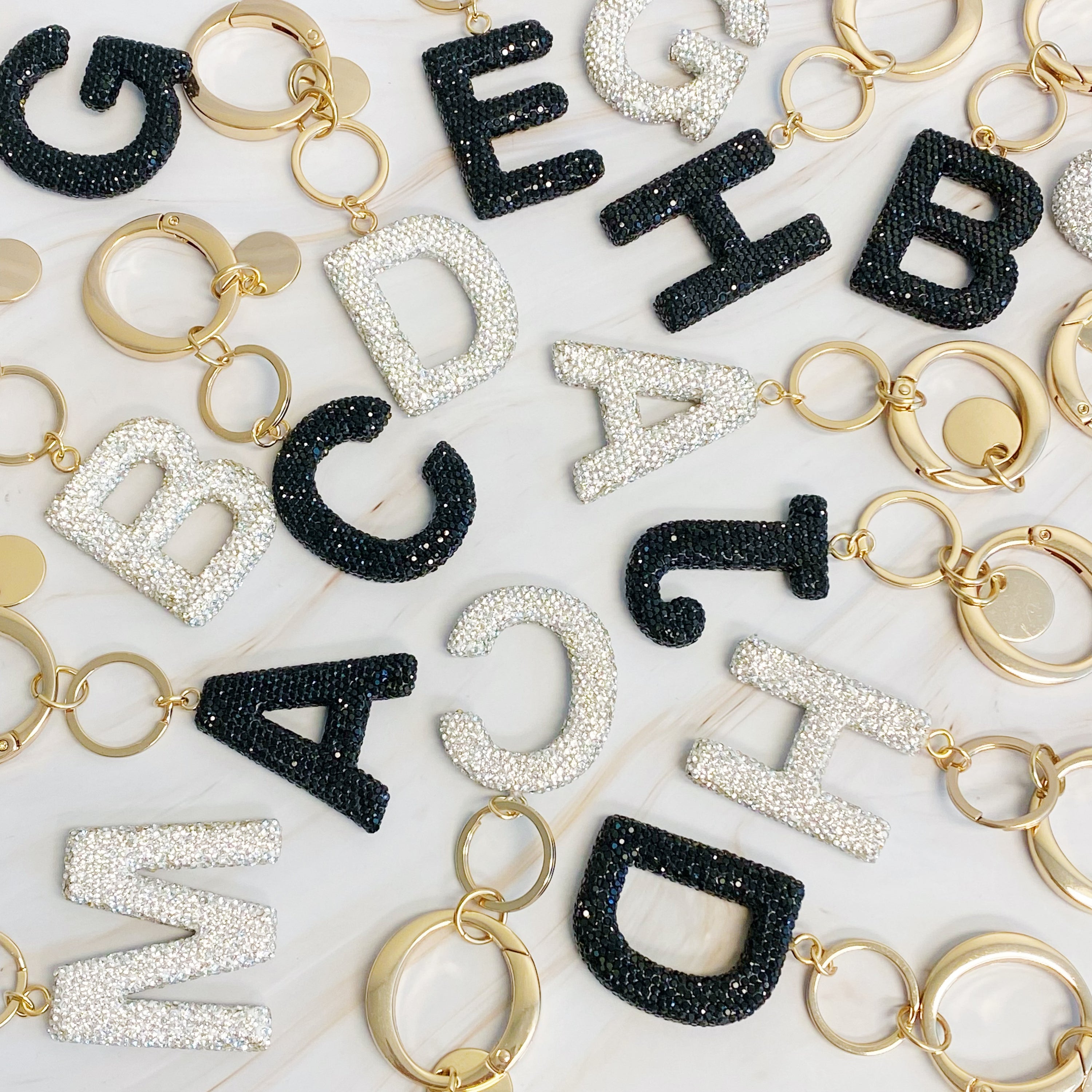 It Girl Glam Initial Key Chain featuring a stylish initial design, perfect for personal expression and gifting.