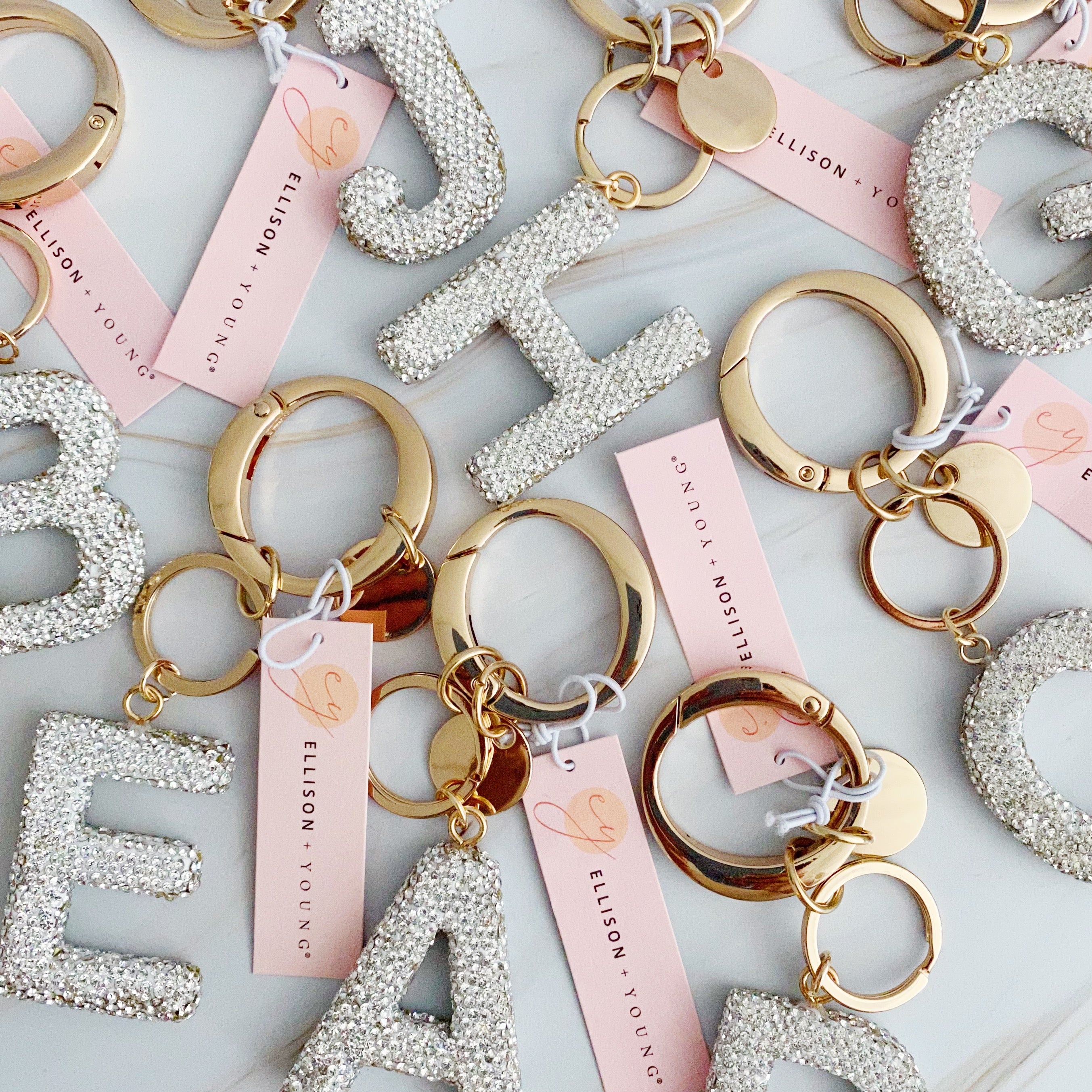 It Girl Glam Initial Key Chain featuring a stylish initial design, perfect for personal expression and gifting.