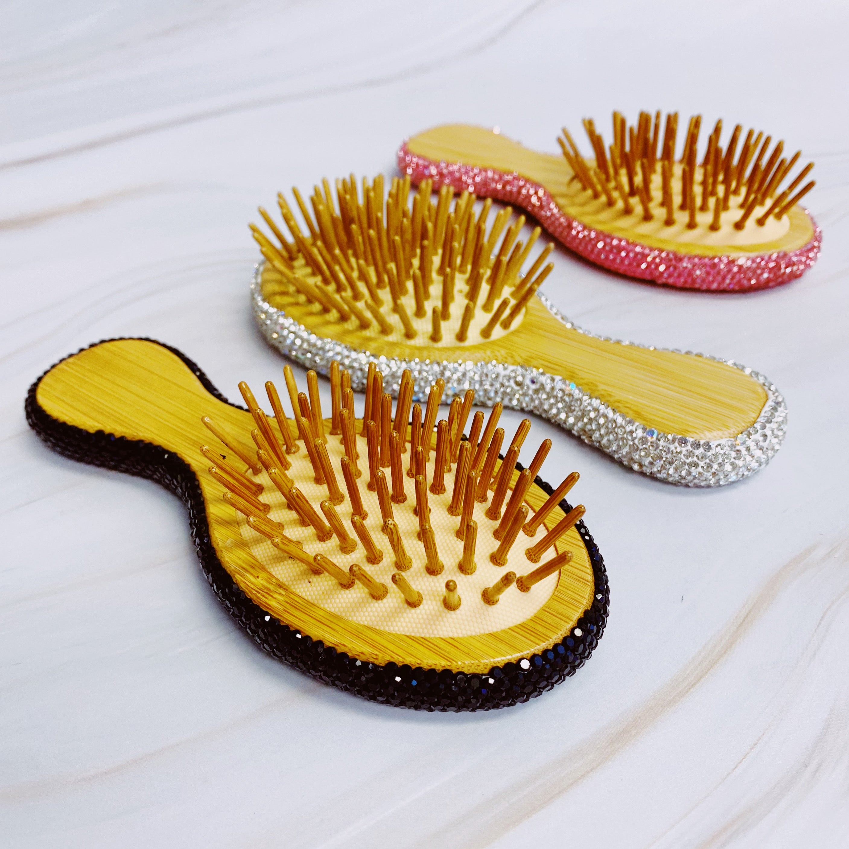 It Girl Life Glam Hair Brush featuring sparkling rhinestones and wooden bristles, perfect for stylish hair care.