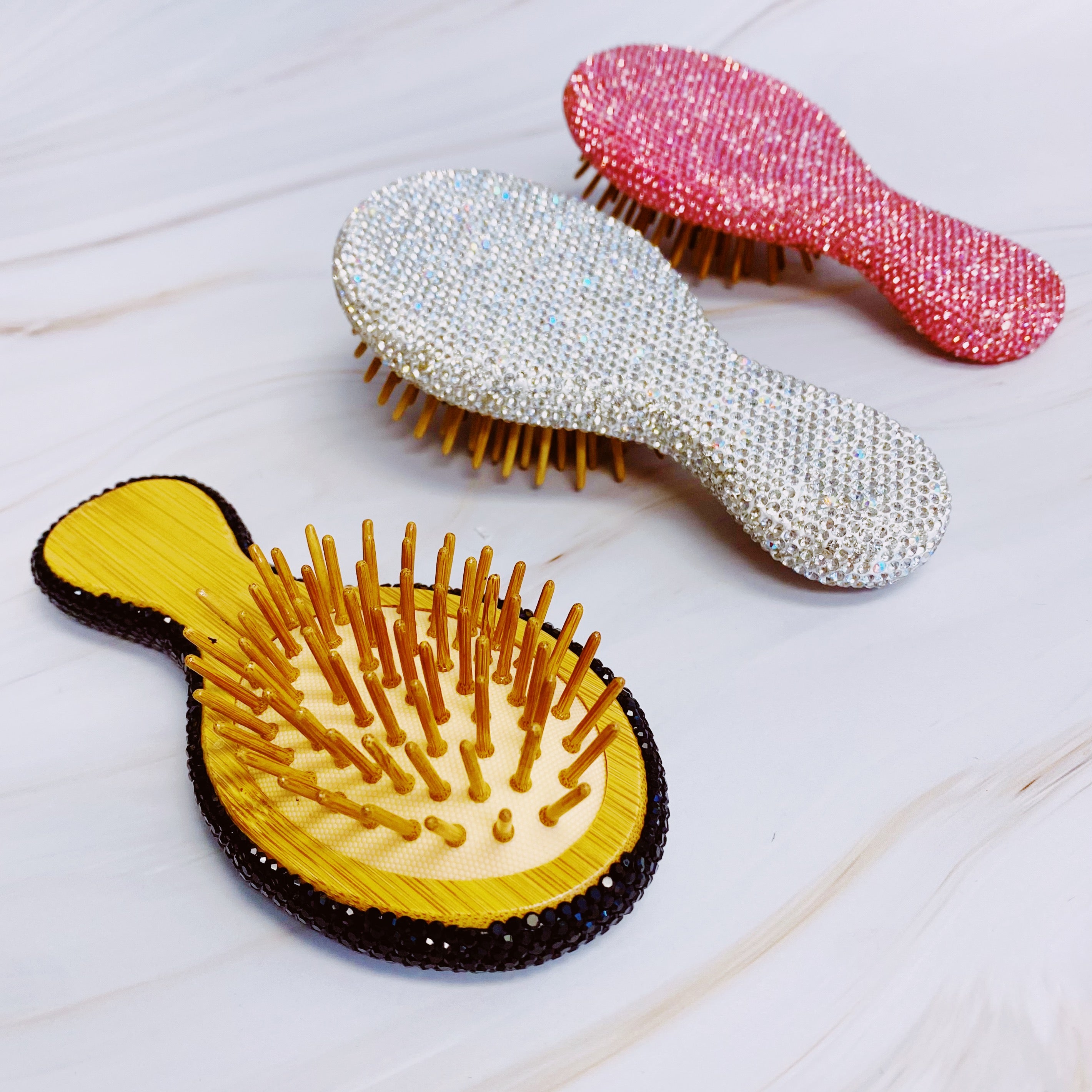 It Girl Life Glam Hair Brush featuring sparkling rhinestones and wooden bristles, perfect for stylish hair care.