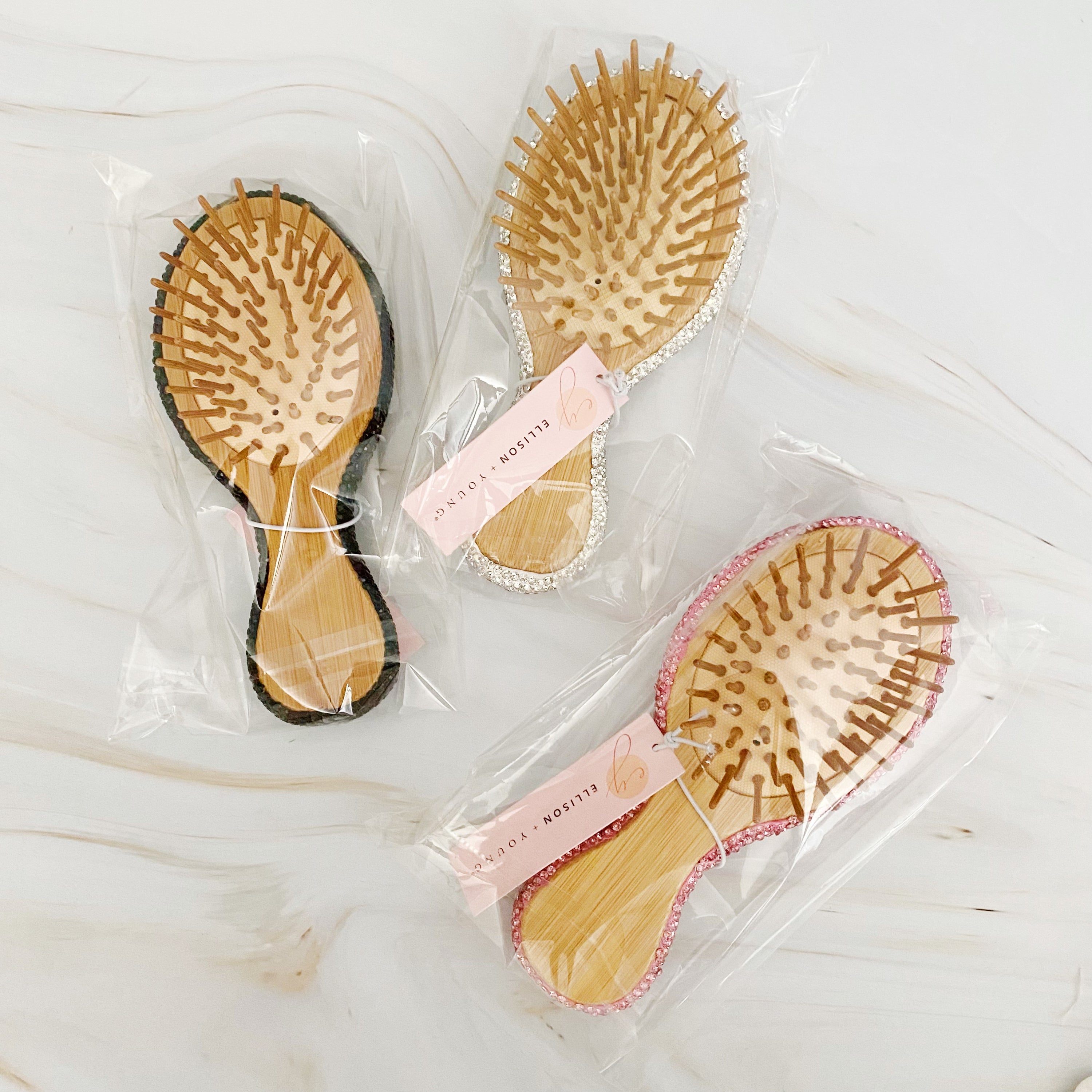 It Girl Life Glam Hair Brush featuring sparkling rhinestones and wooden bristles, perfect for stylish hair care.