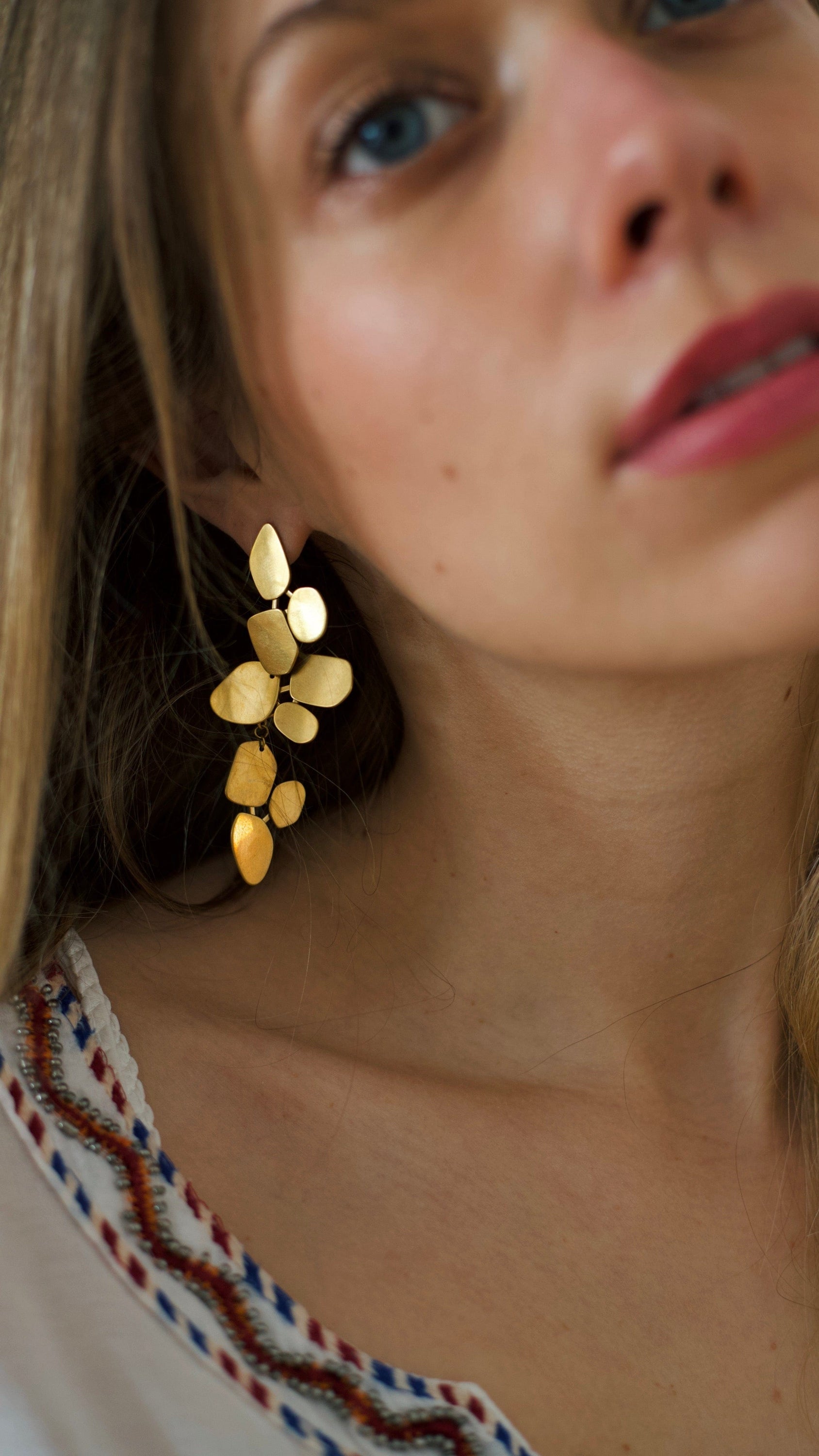 Ivy Leaf Dangle Earrings featuring a chandelier design with geometric shapes in matte 18Kt yellow gold over titanium steel.