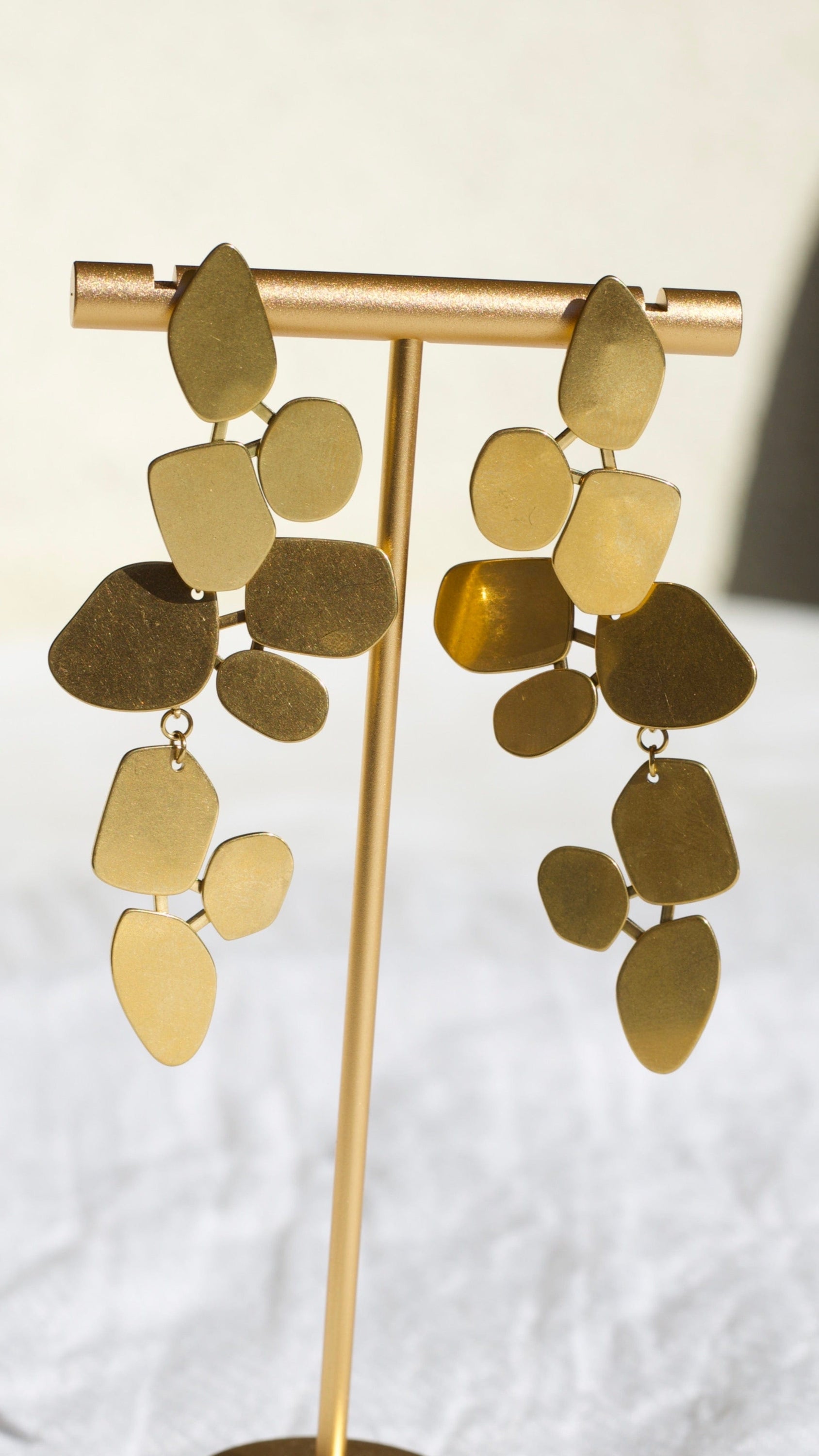 Ivy Leaf Dangle Earrings featuring a chandelier design with geometric shapes in matte 18Kt yellow gold over titanium steel.