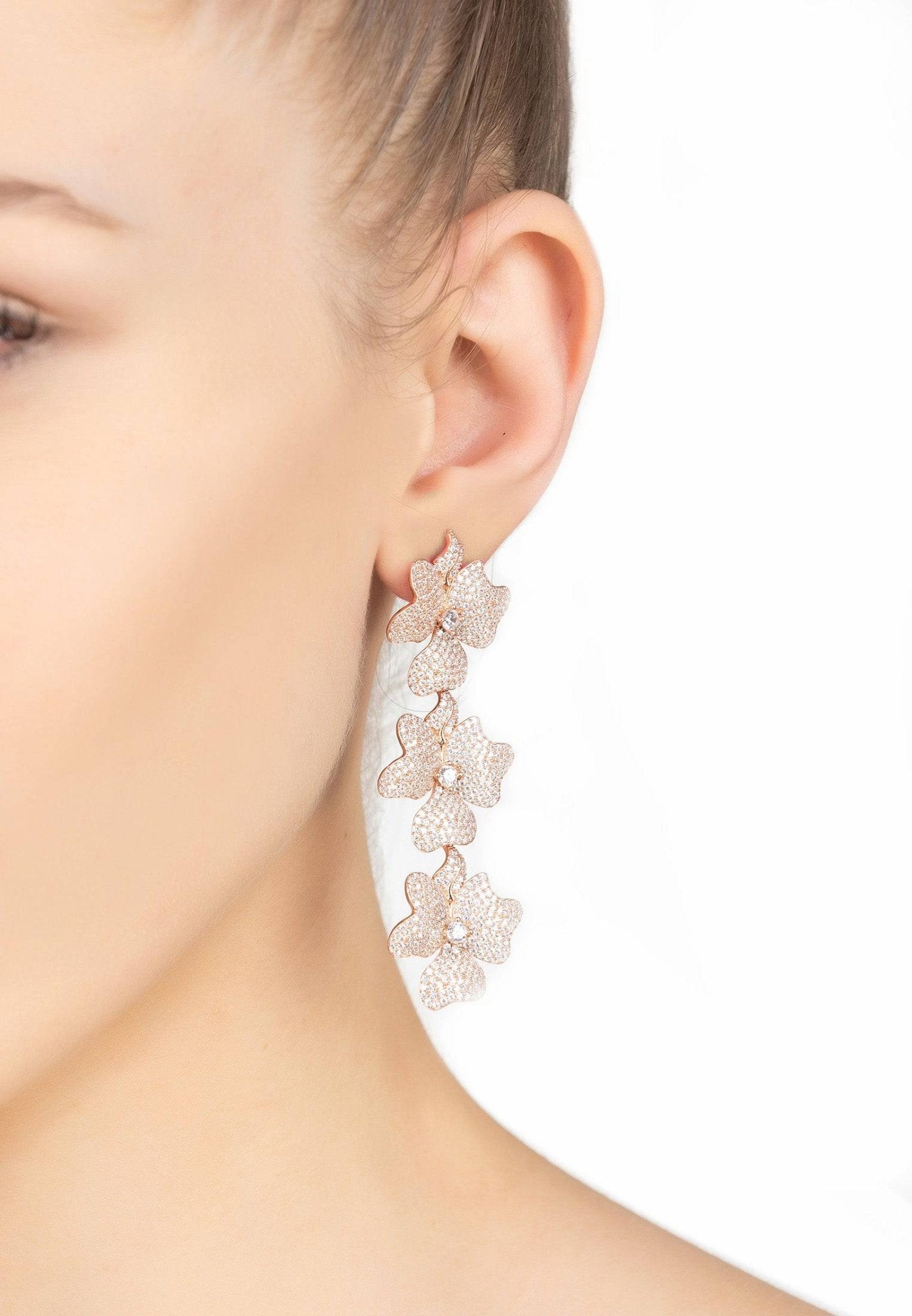 Jasmine Flower Triple Drop Earrings in Rosegold featuring three floral designs adorned with sparkling cubic zirconia.