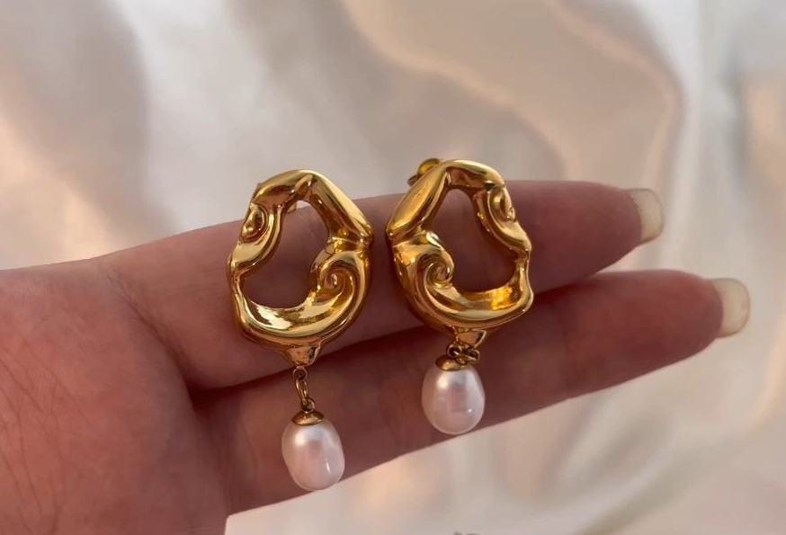 Jove gold hoops featuring baroque studs and dangling freshwater pearl drops, elegantly designed for a whimsical look.