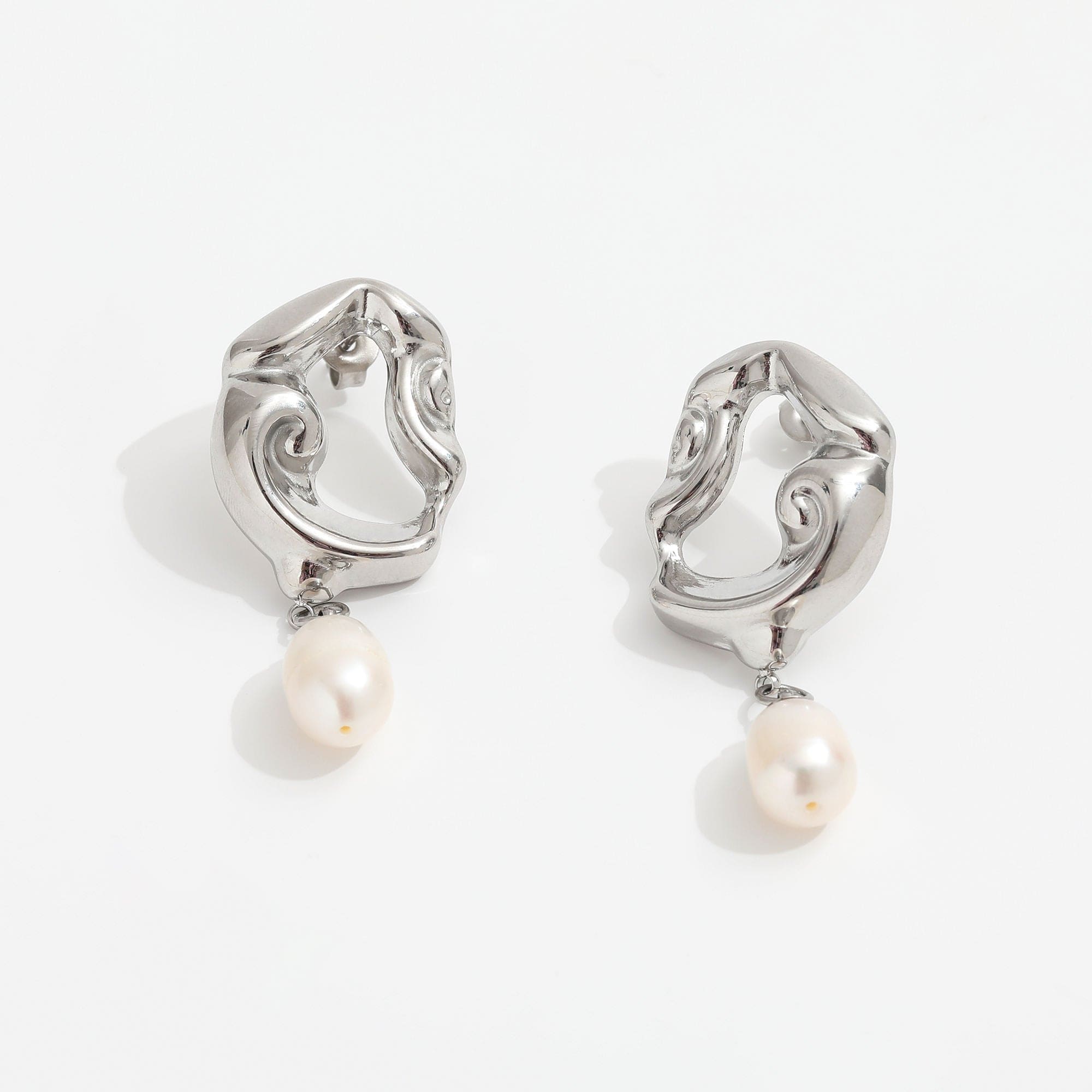 Jove gold hoops featuring baroque studs and dangling freshwater pearl drops, elegantly designed for a whimsical look.