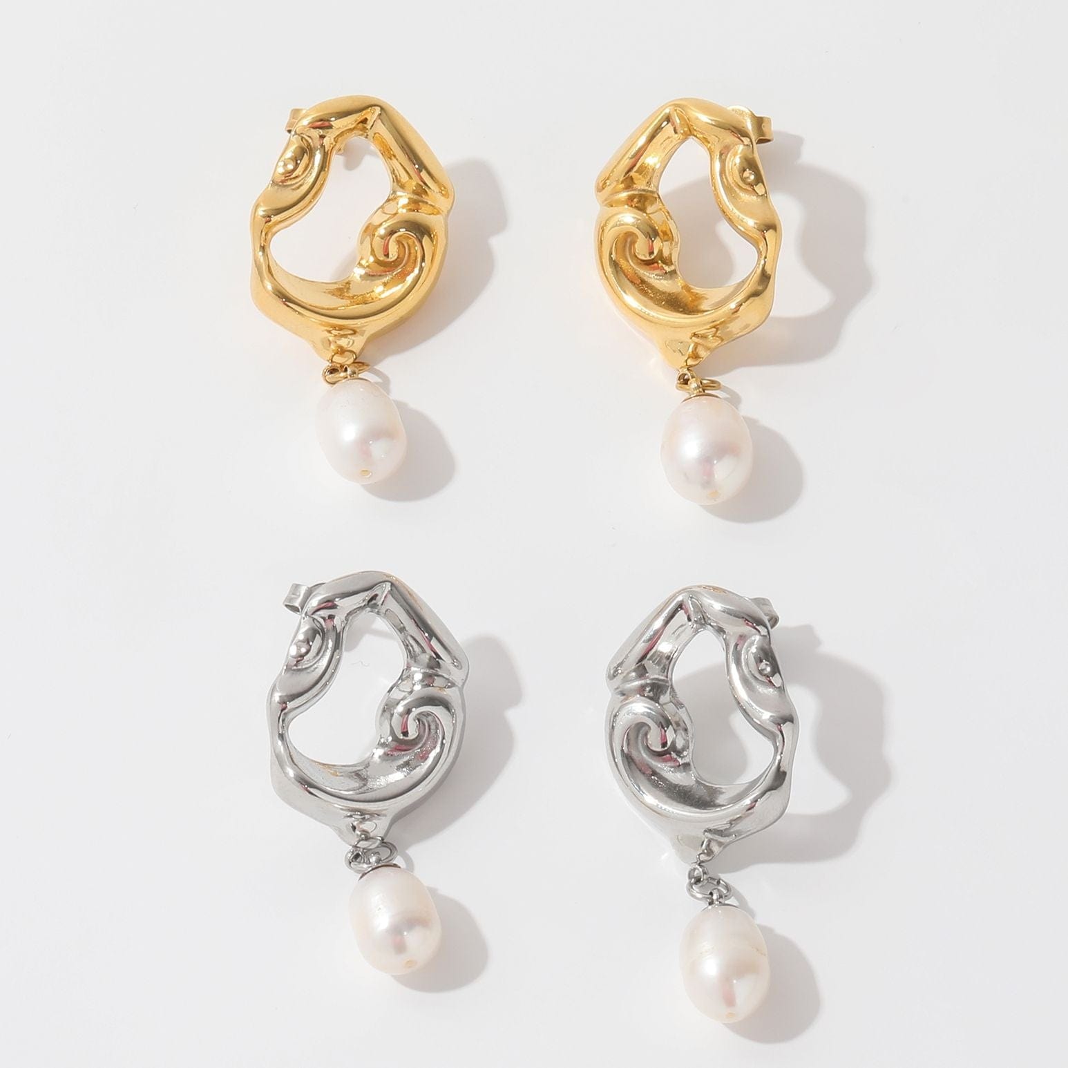 Jove gold hoops featuring baroque studs and dangling freshwater pearl drops, elegantly designed for a whimsical look.