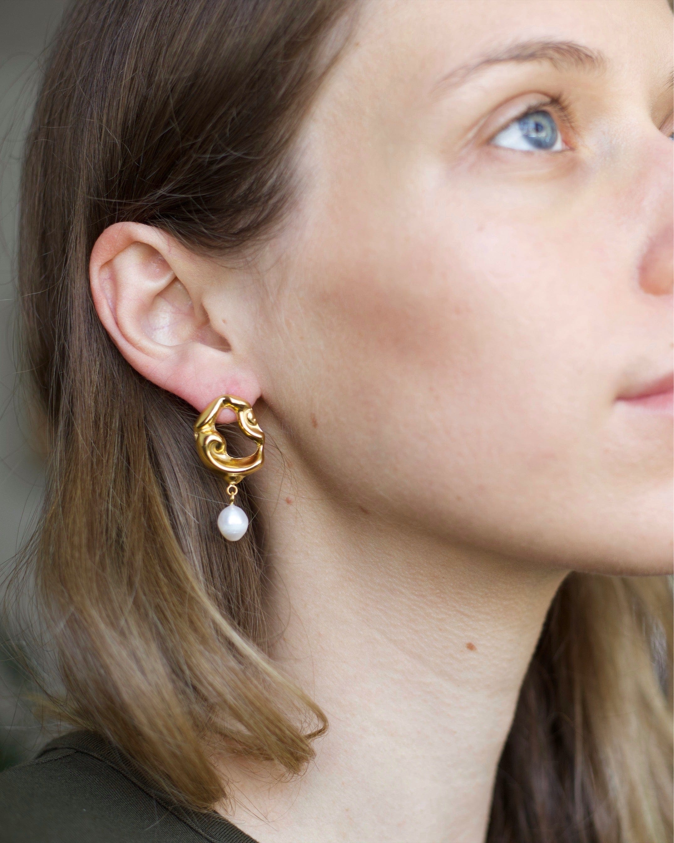 Jove gold hoops featuring baroque studs and dangling freshwater pearl drops, elegantly designed for a whimsical look.