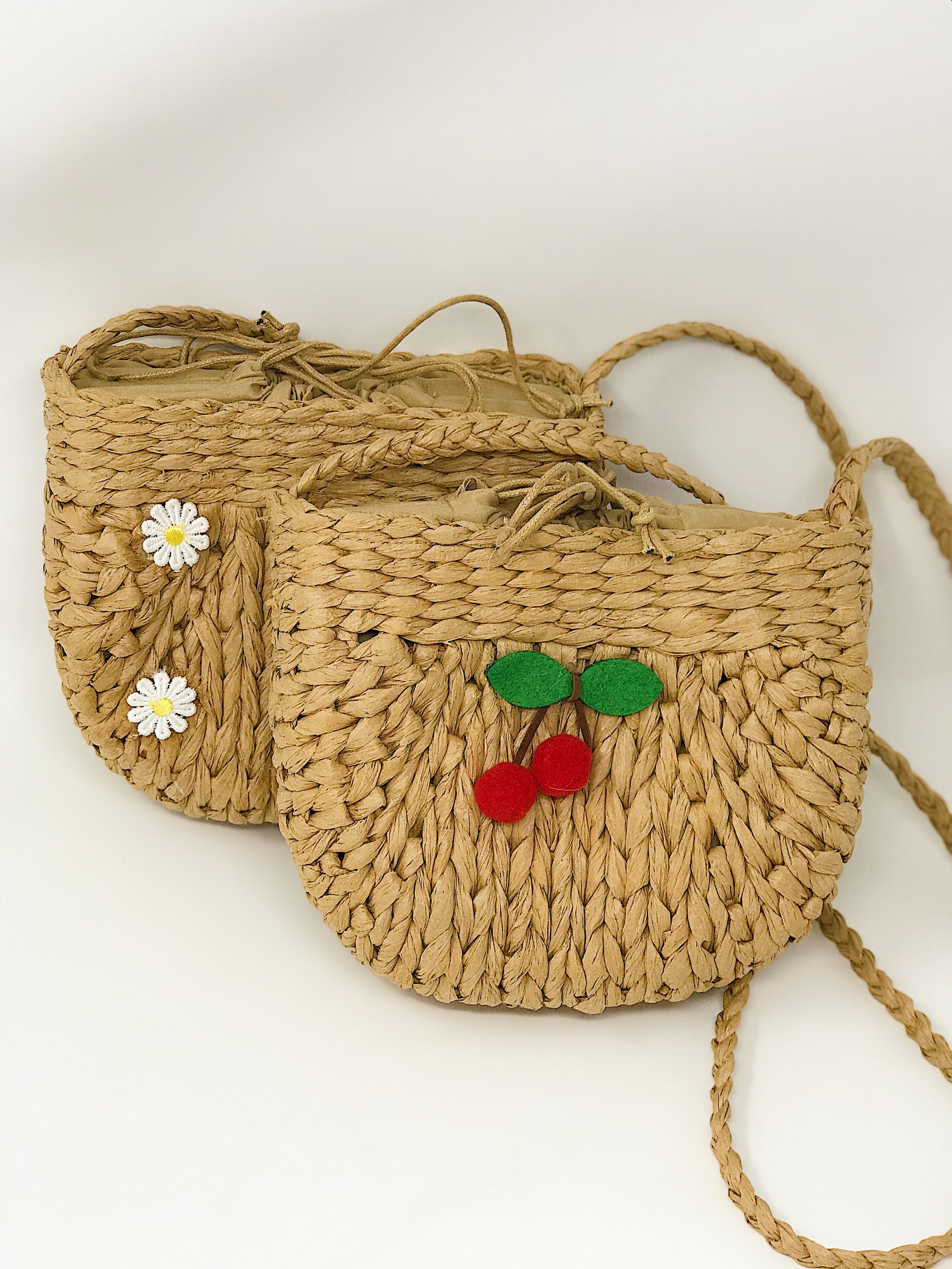 Juicy Bloom Straw Crossbody Bag with embroidered design, showcasing its stylish and functional features.