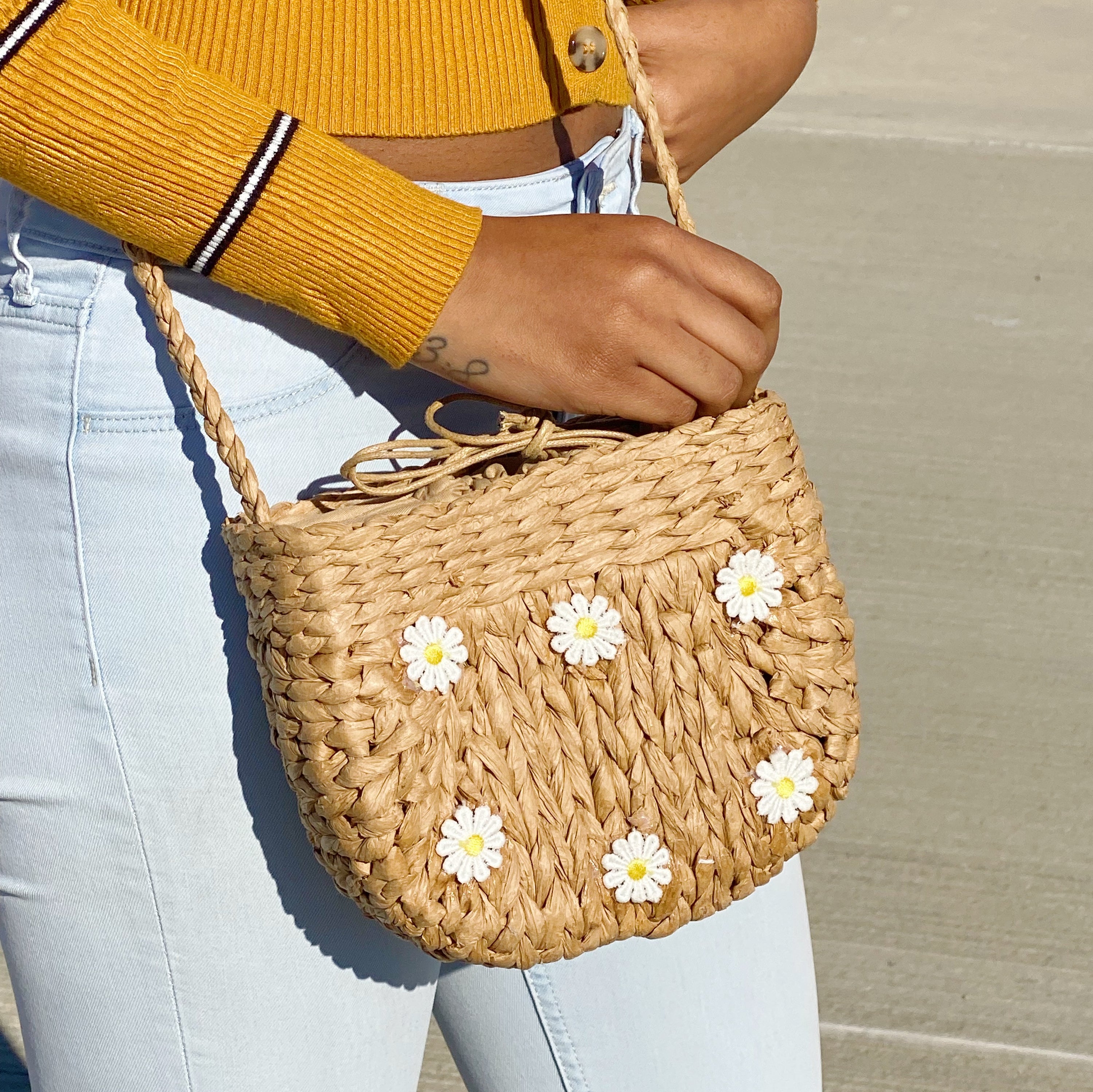 Juicy Bloom Straw Crossbody Bag with embroidered design, showcasing its stylish and functional features.