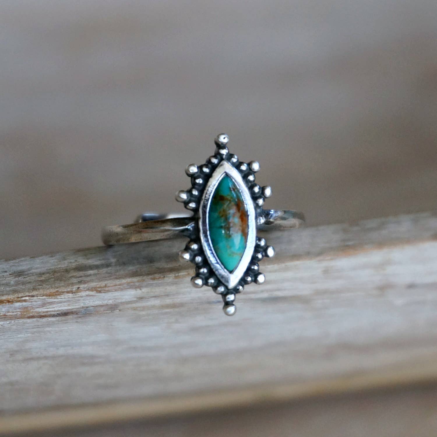 Kal Turquoise Ring featuring a natural turquoise stone set in a solid 925 sterling silver adjustable band, handcrafted by Sowell Jewelry.