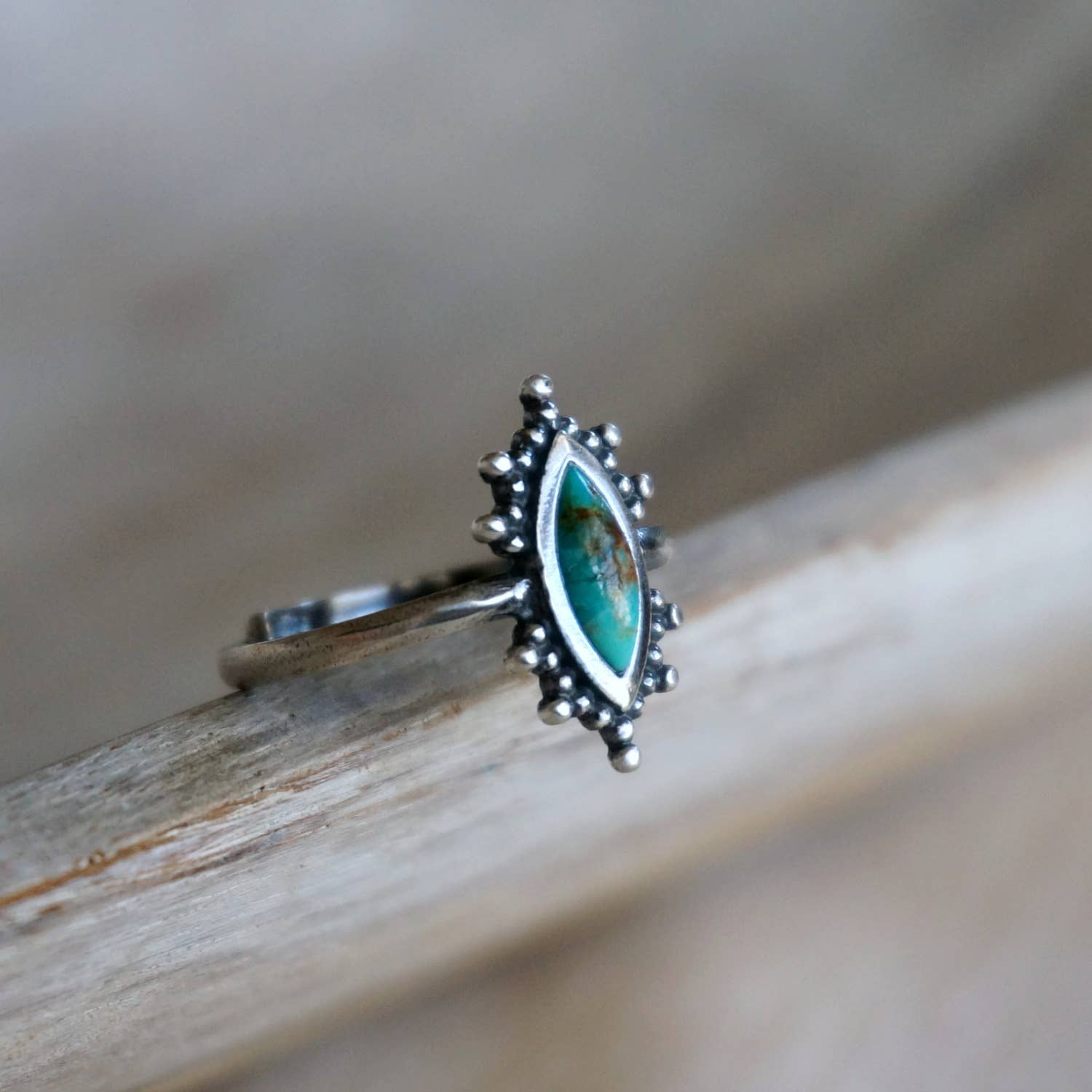 Kal Turquoise Ring featuring a natural turquoise stone set in a solid 925 sterling silver adjustable band, handcrafted by Sowell Jewelry.