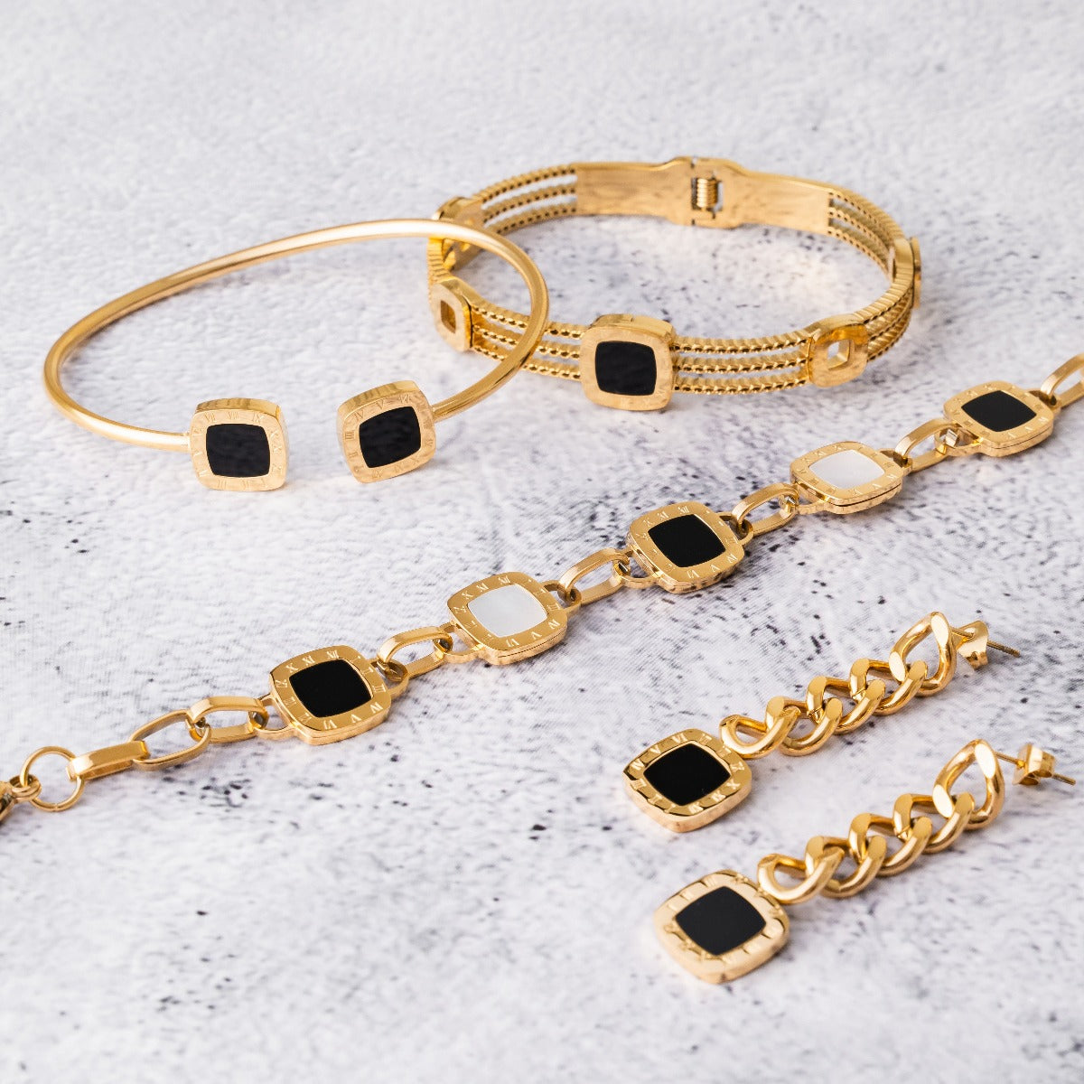 Kaltham Onyx Square Bangle Bracelet in gold, showcasing its elegant design and durable stainless steel material.