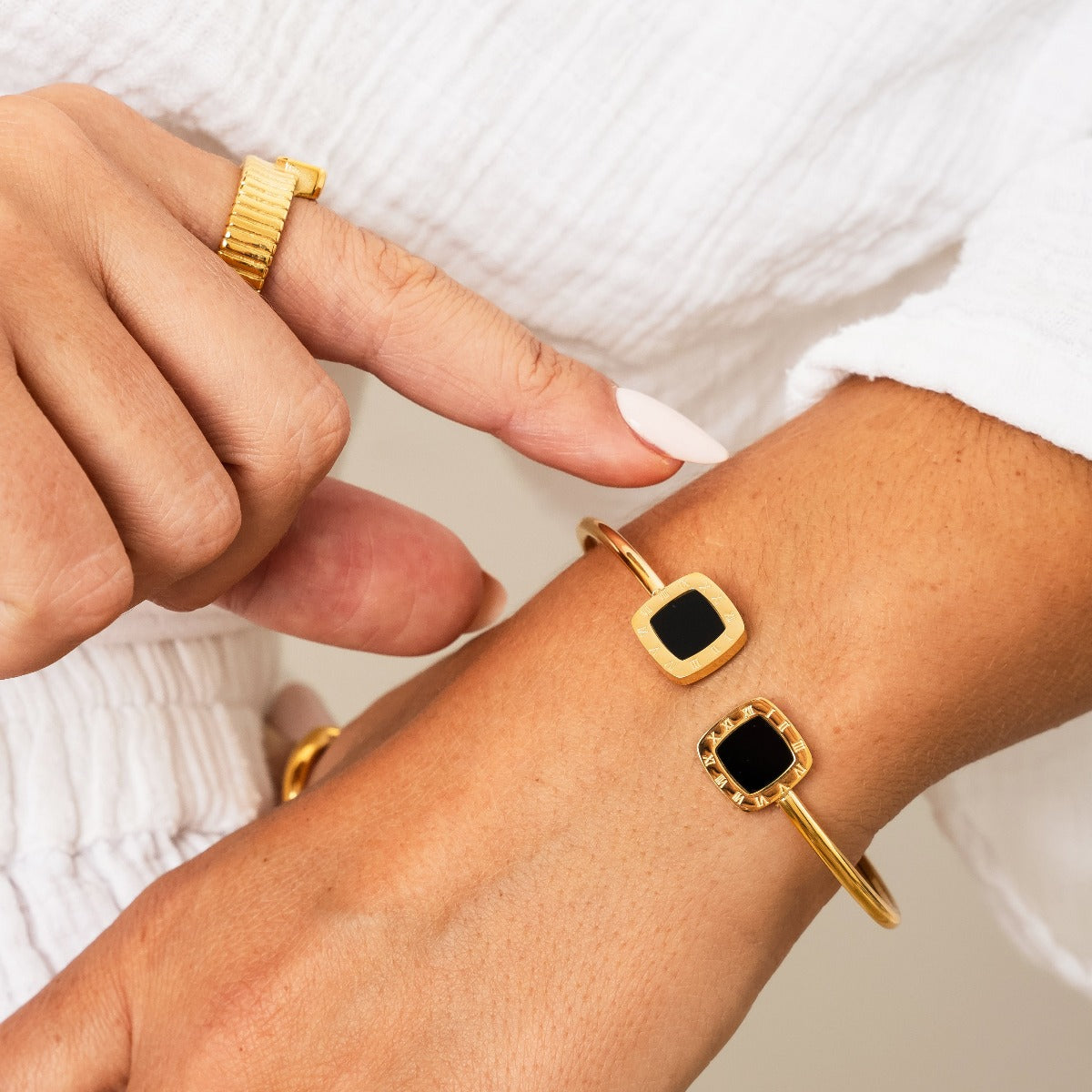 Kaltham Onyx Square Bangle Bracelet in gold, showcasing its elegant design and durable stainless steel material.