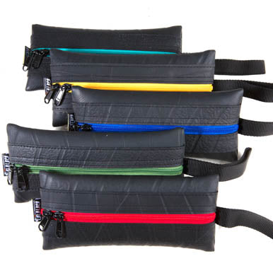 Kat Slimline Recycled Rubber Vegan Pencil Case in vibrant colors, showcasing its unique handmade design and eco-friendly materials.