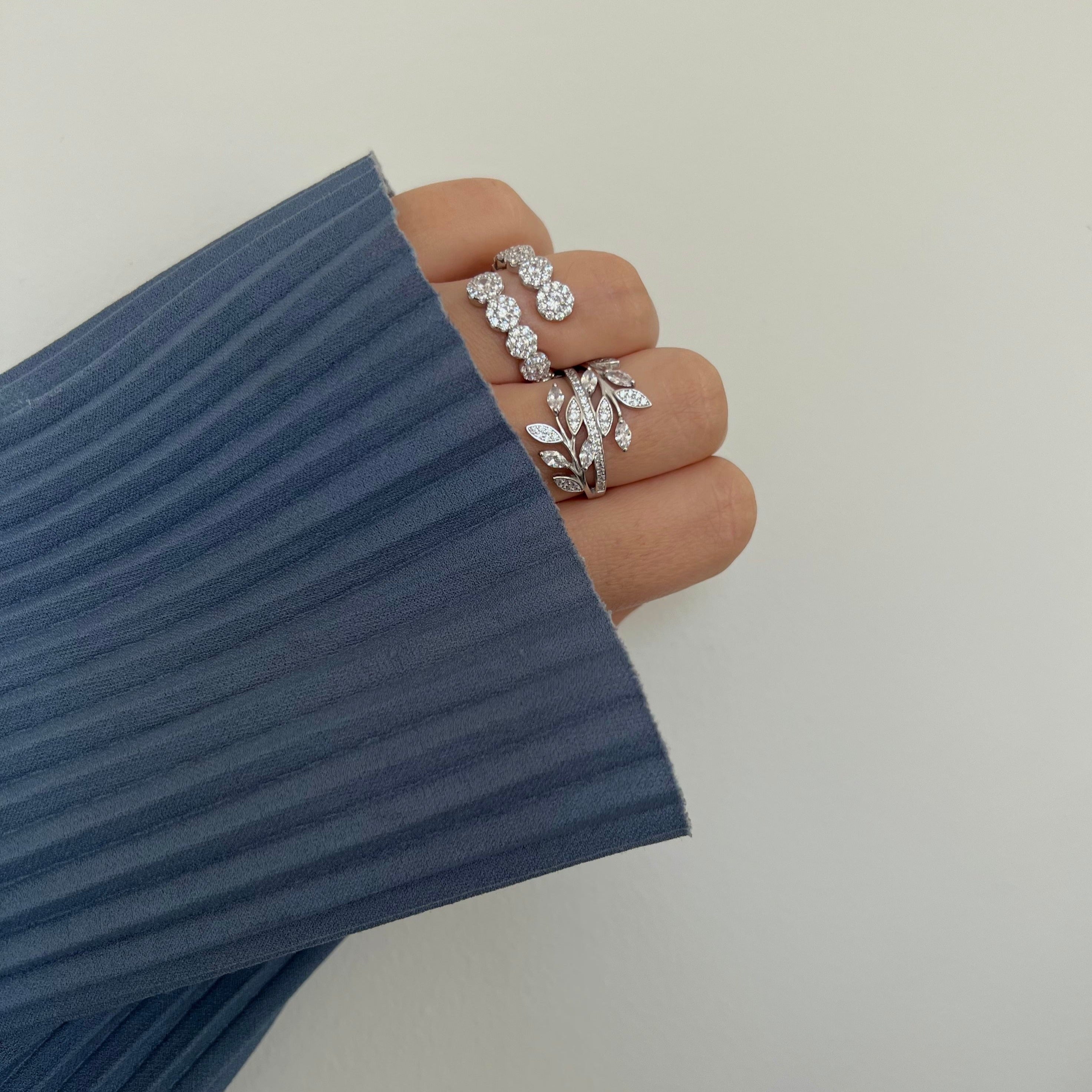 Katya CZ Wrap Ring featuring a unique wrap design with sparkling cubic zirconia stones, available in sizes 7, 8, and 9.