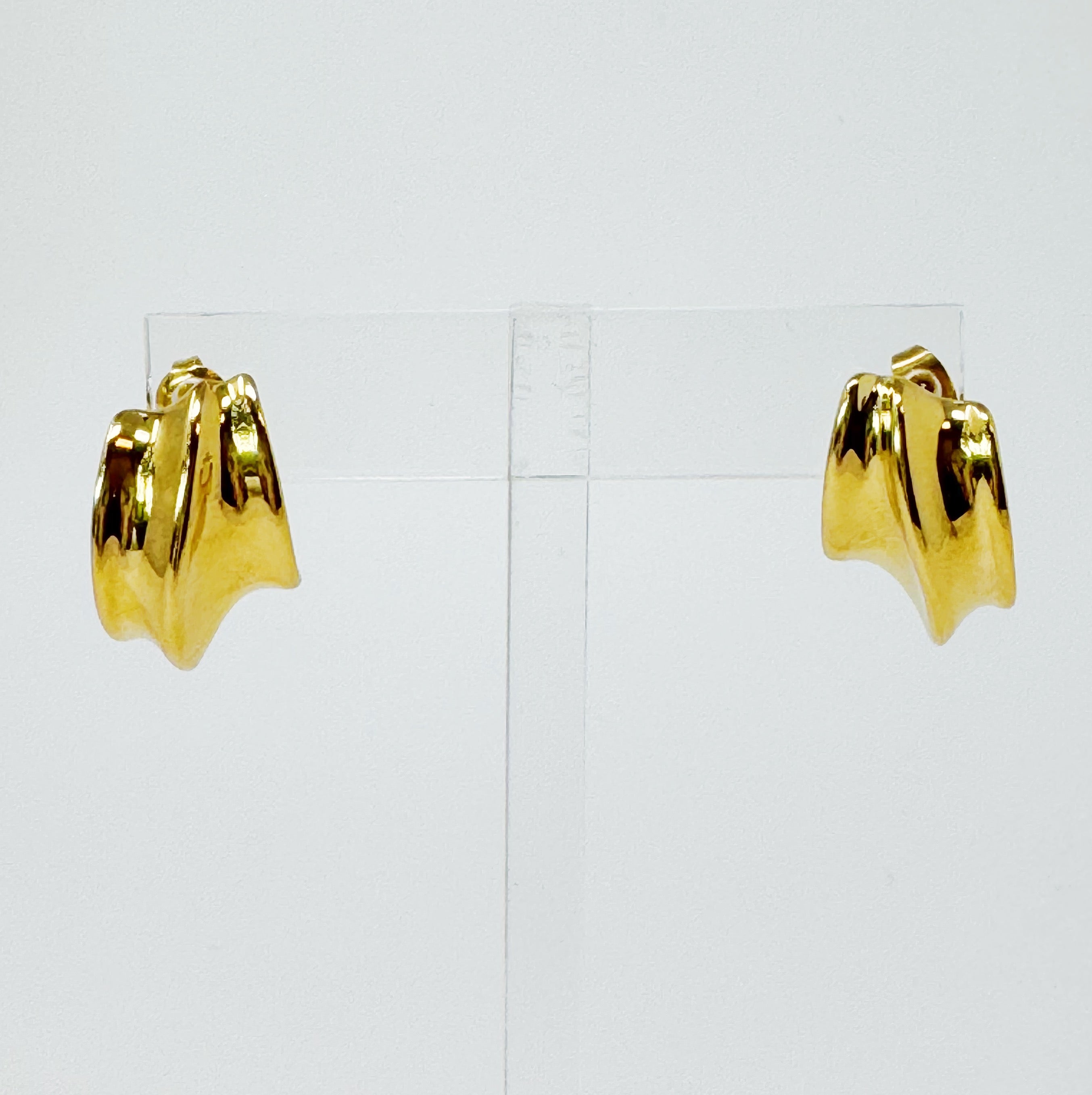 A pair of Kelly Golden Hoop Earrings made from 18k gold plated stainless steel, showcasing a modern and chic design.