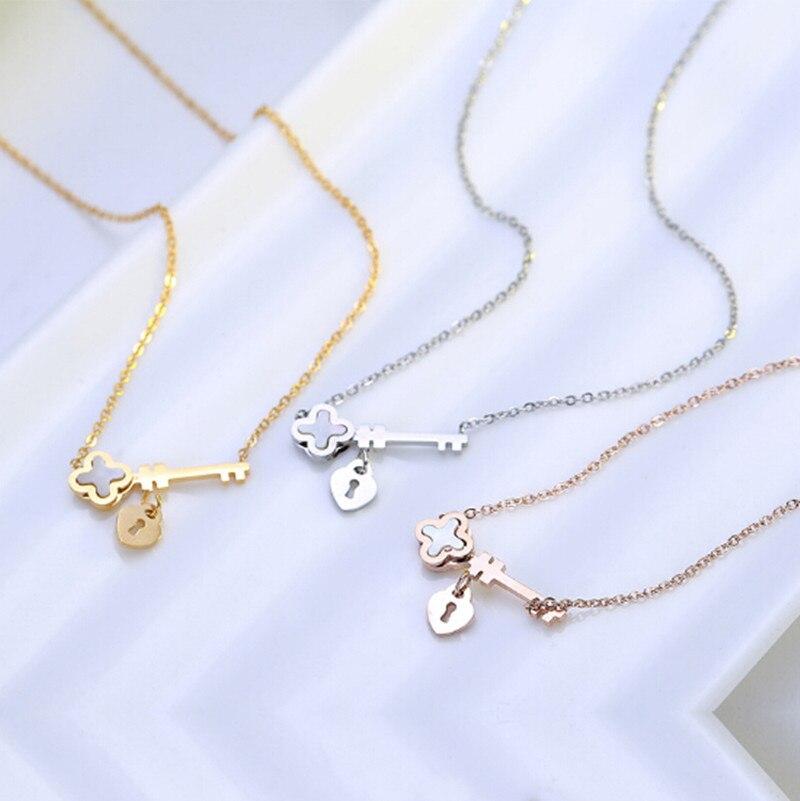 Key to My Heart Necklace in rose gold, silver, and gold finishes with a tiny opal clover accent.