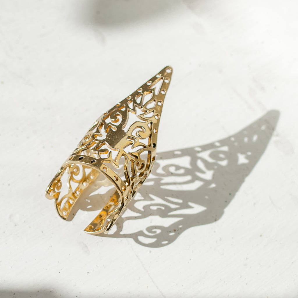 Khmer Temple Ring made from recycled brass bombshells, featuring a traditional Khmer pattern, handcrafted by Cambodian artisans.