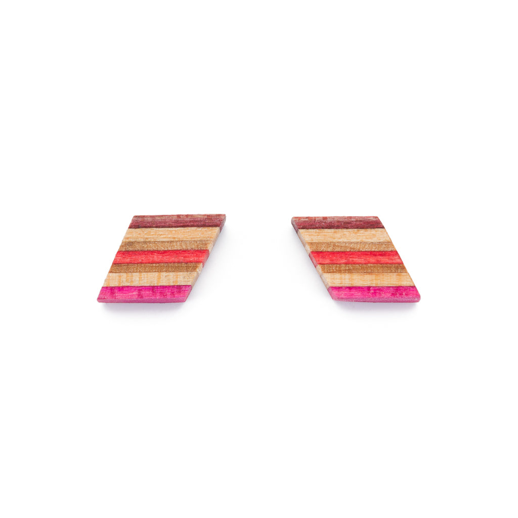 Kite Recycled Skateboard Wooden Stud Earrings showcasing colorful layers and unique designs, handcrafted from upcycled skateboards.