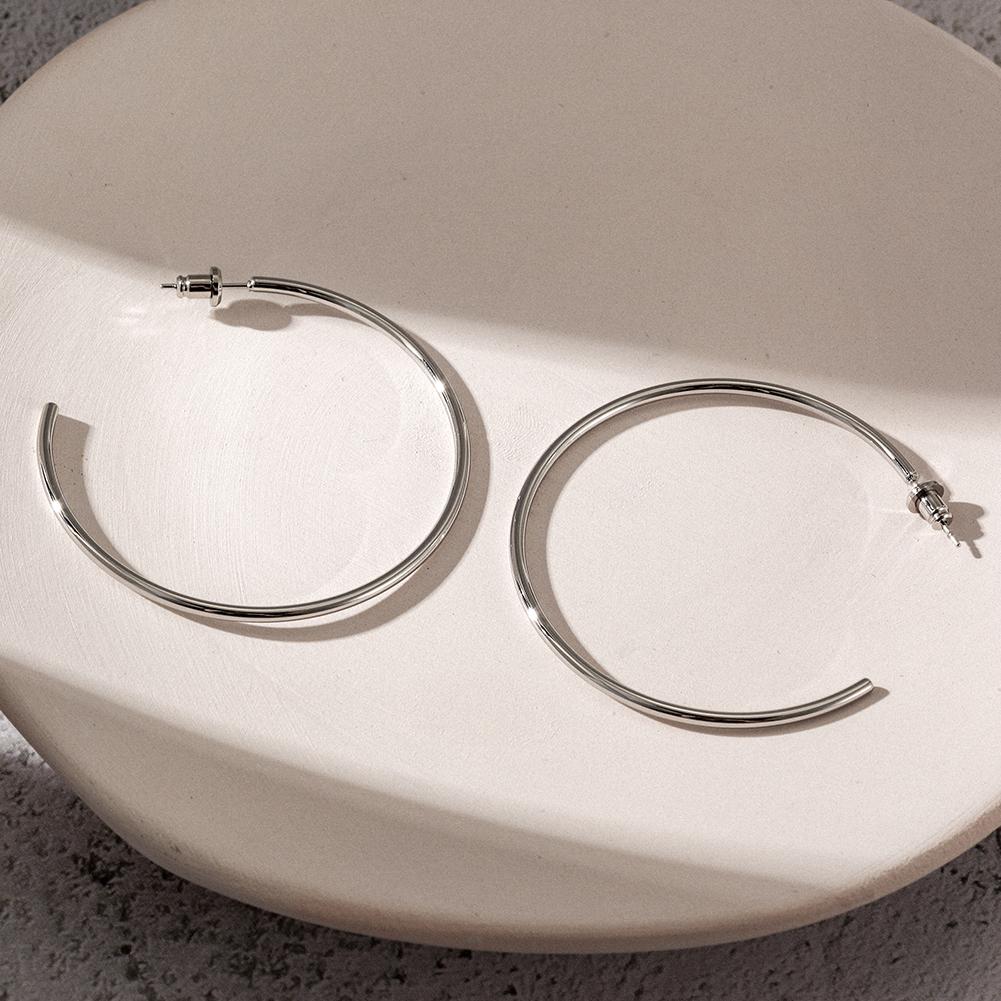 A pair of elegant KLO hoop earrings made from stainless steel, showcasing a sleek and stylish design suitable for everyday wear.