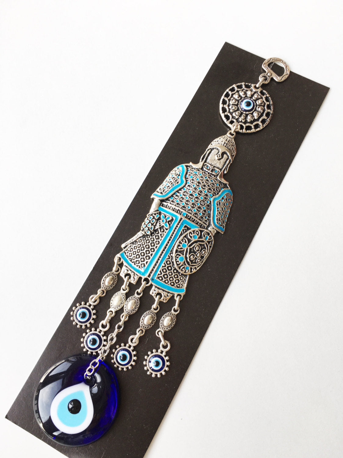 Handmade Knight Evil Eye Wall Hanging featuring vibrant glass evil eyes and metal symbols for luck and protection.